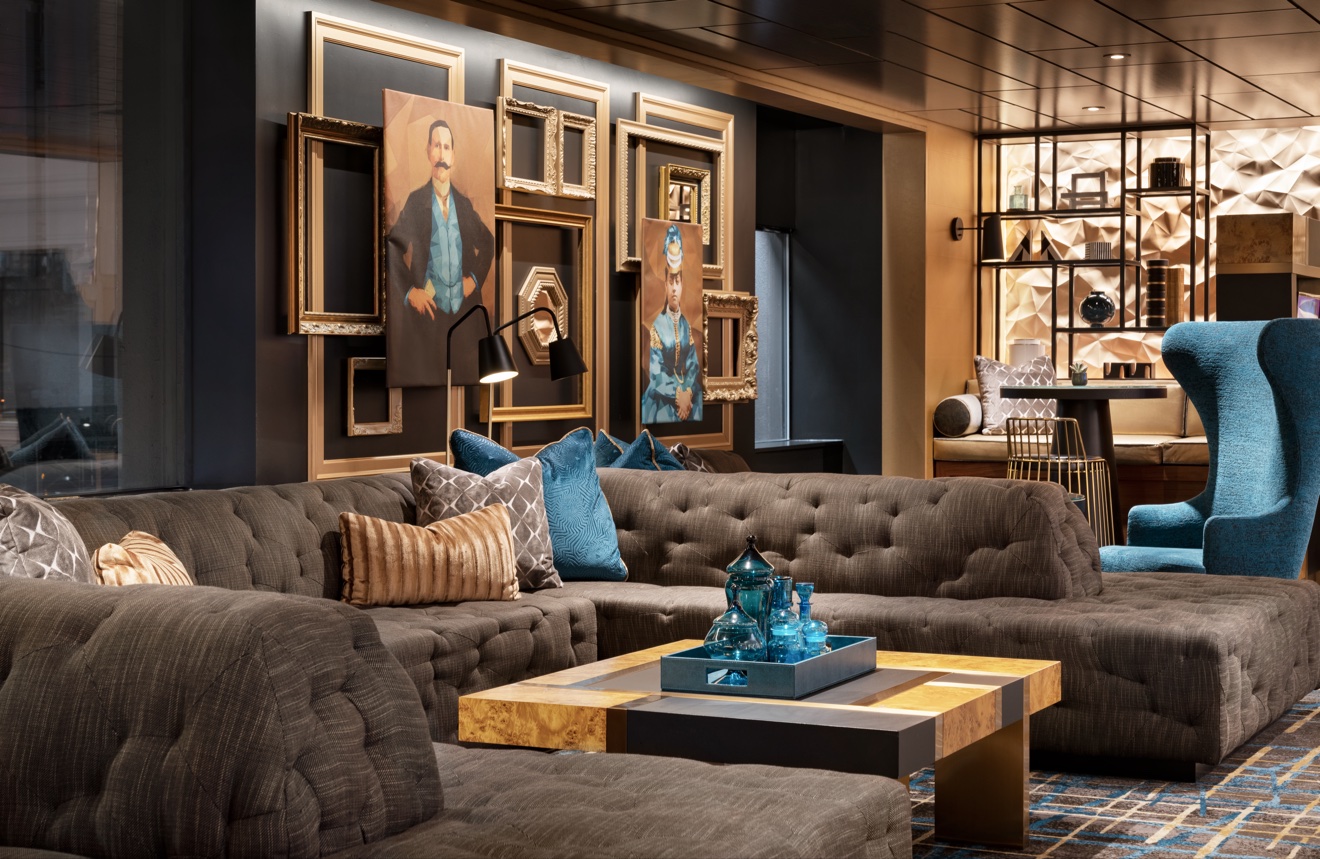 Courtyard Marriott San Francisco lounge with tufted seating and portrait artwork