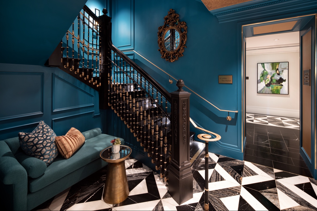 Intimate teal stair landing with built-in settee