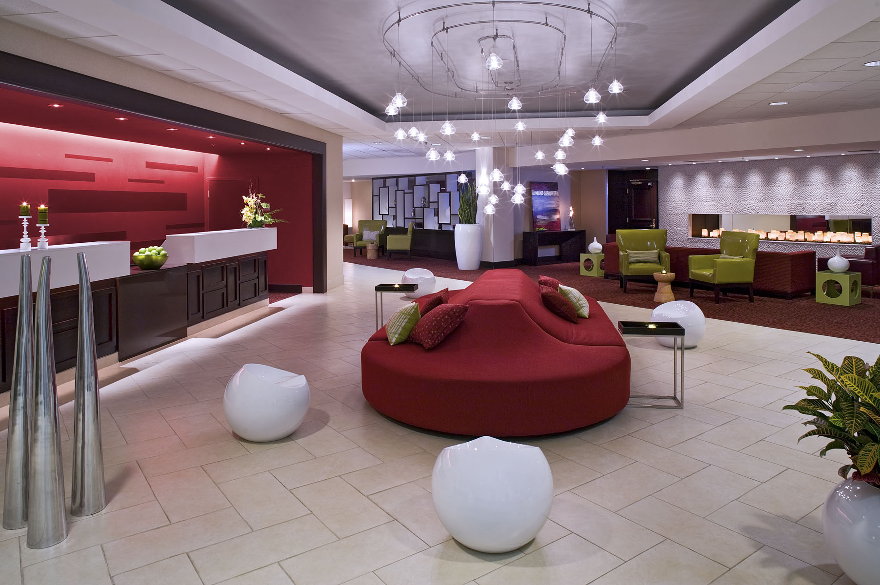Crowne Plaza Hotel lobby with sculptural seating and a circular red ottoman