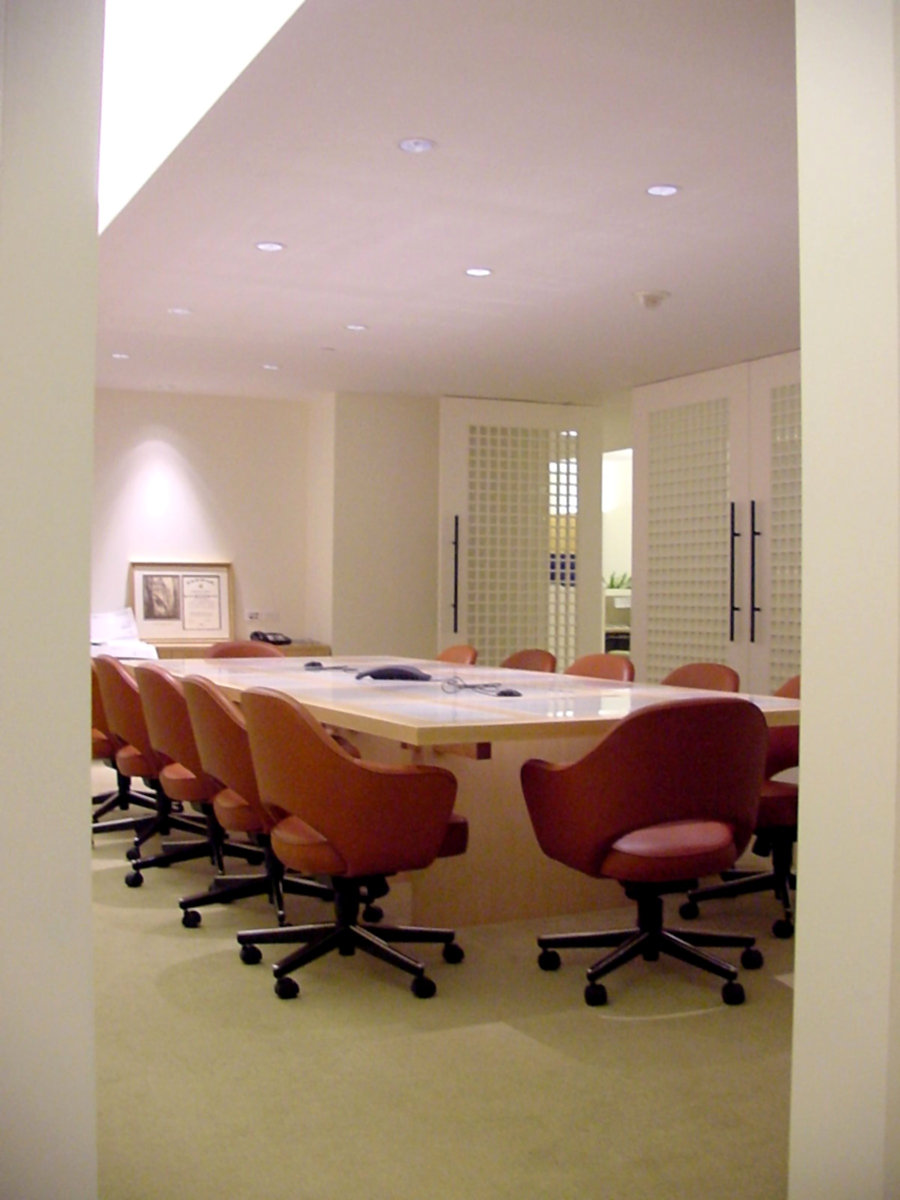 Entravision conference room with a long table and red leather chairs