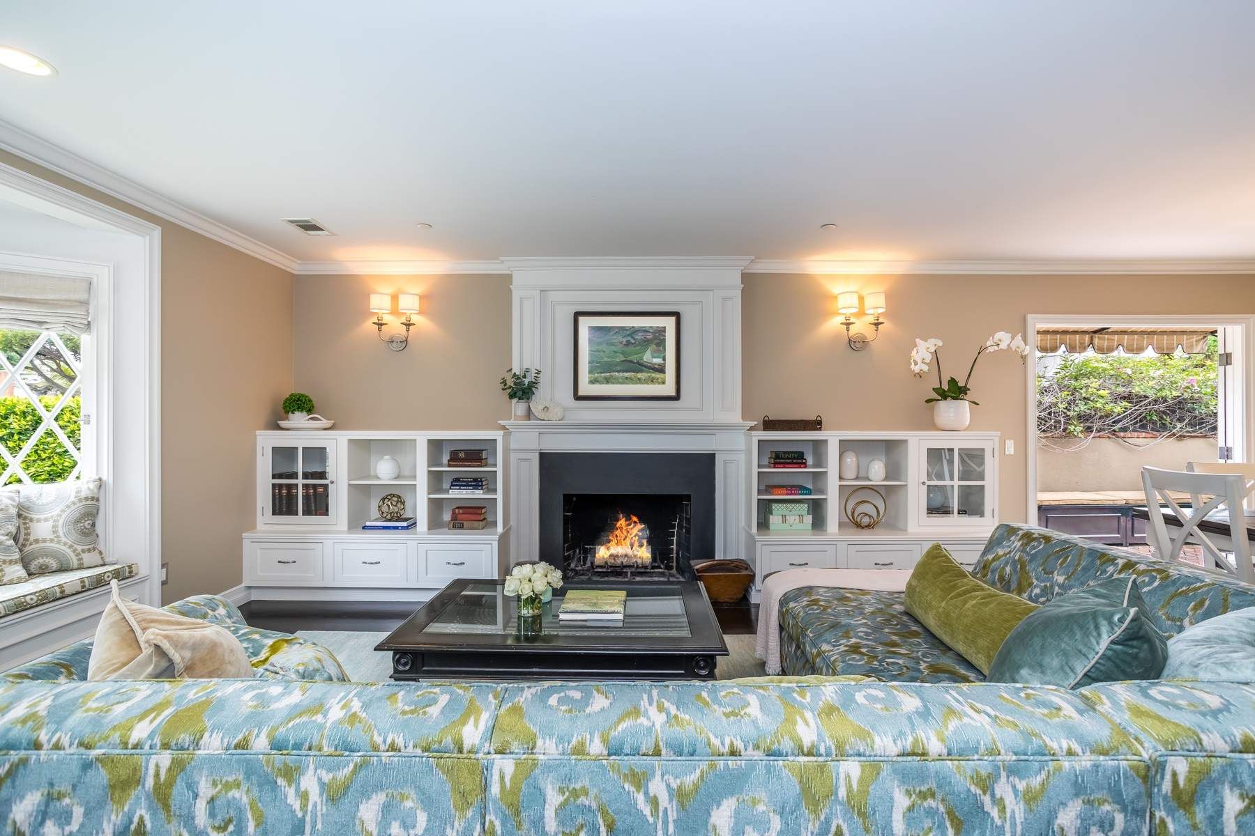 Grant Street Residence living room with patterned seating and a centered fireplace