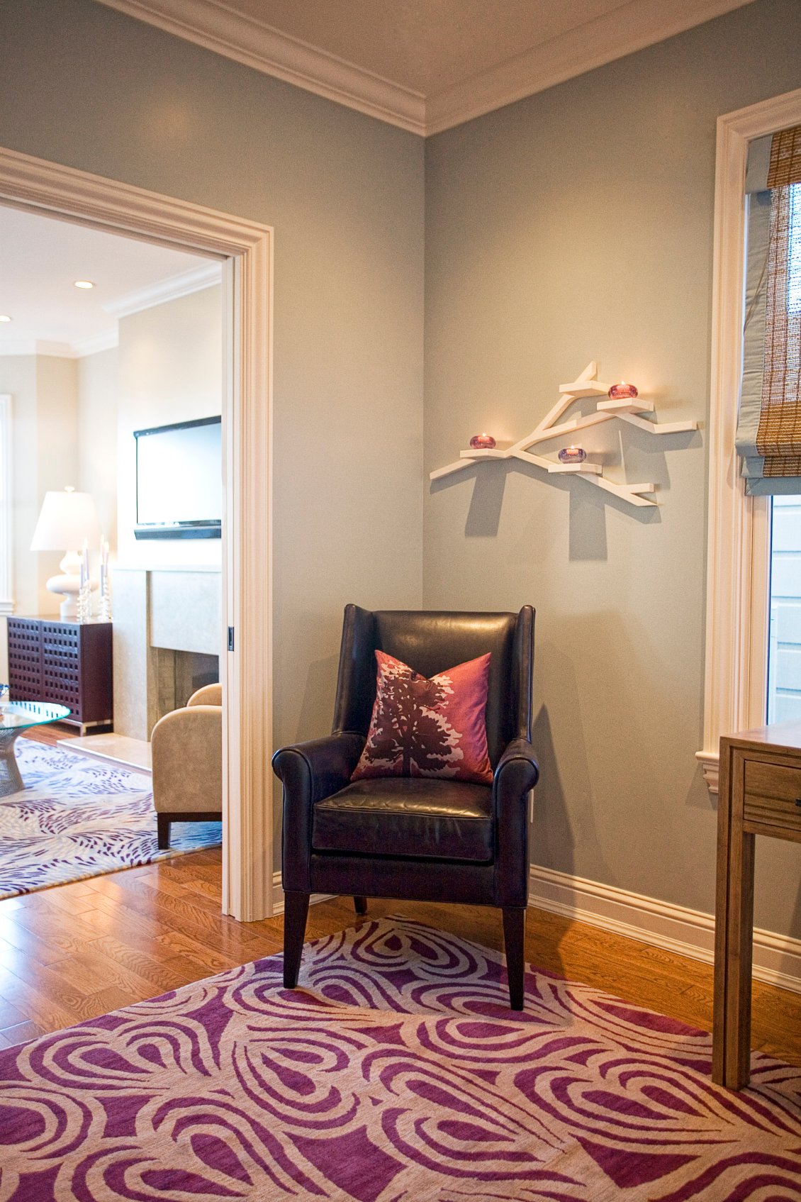 Green Street B Residence sitting room with a red upholstered chair