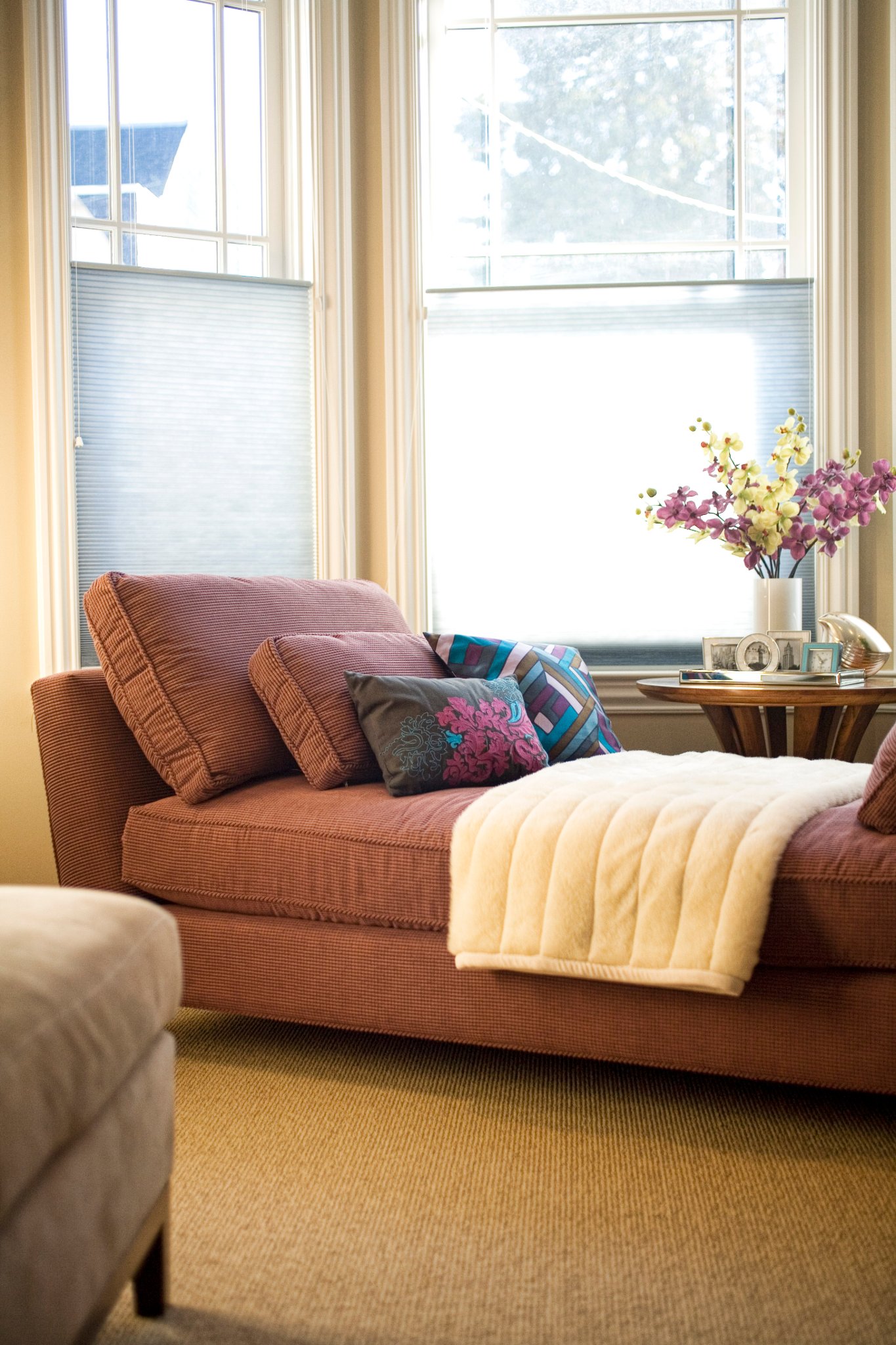 Green Street B Residence sitting room with a curved sofa and bay windows