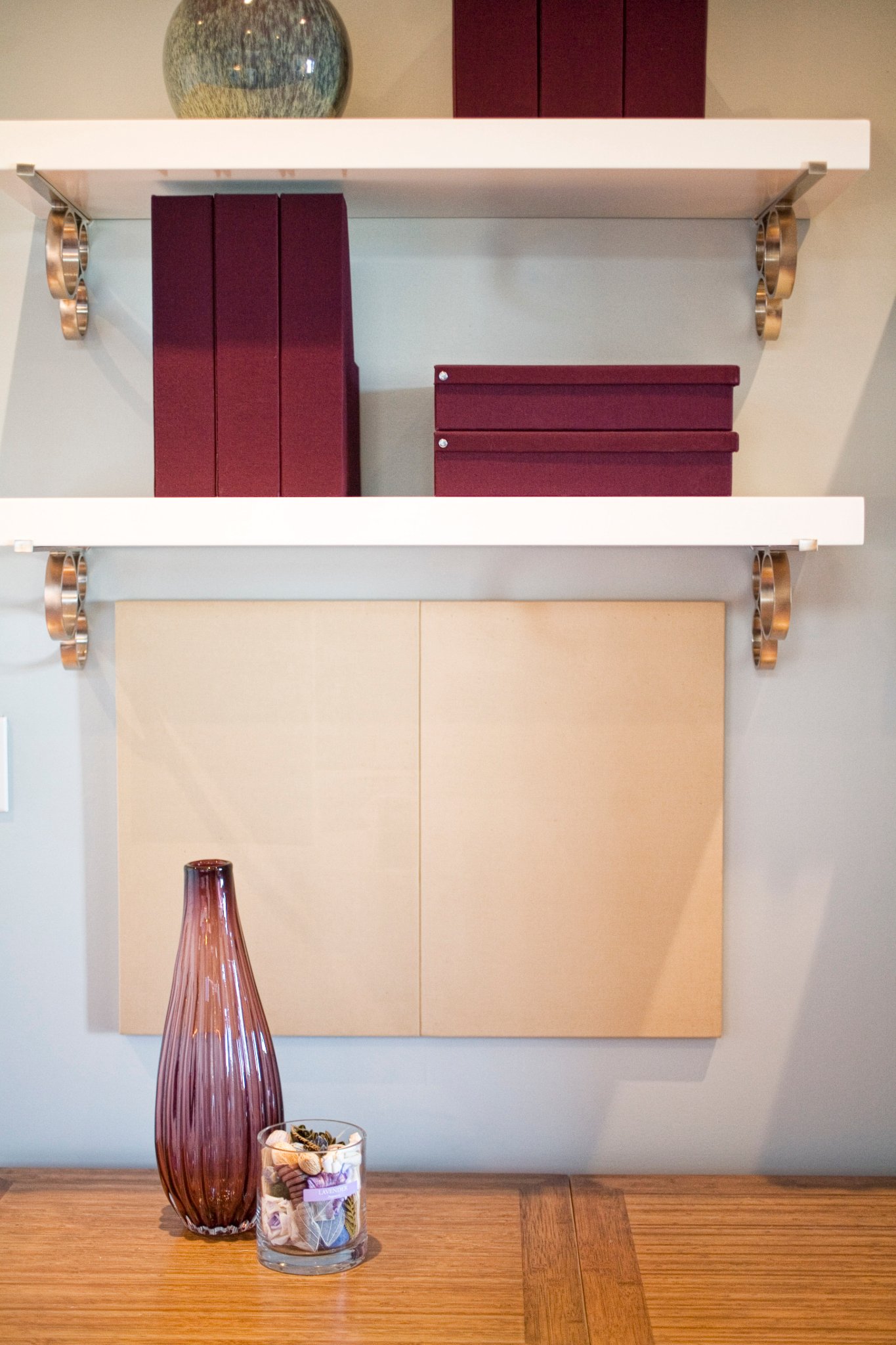 Green Street B Residence display shelf with framed art and decorative objects