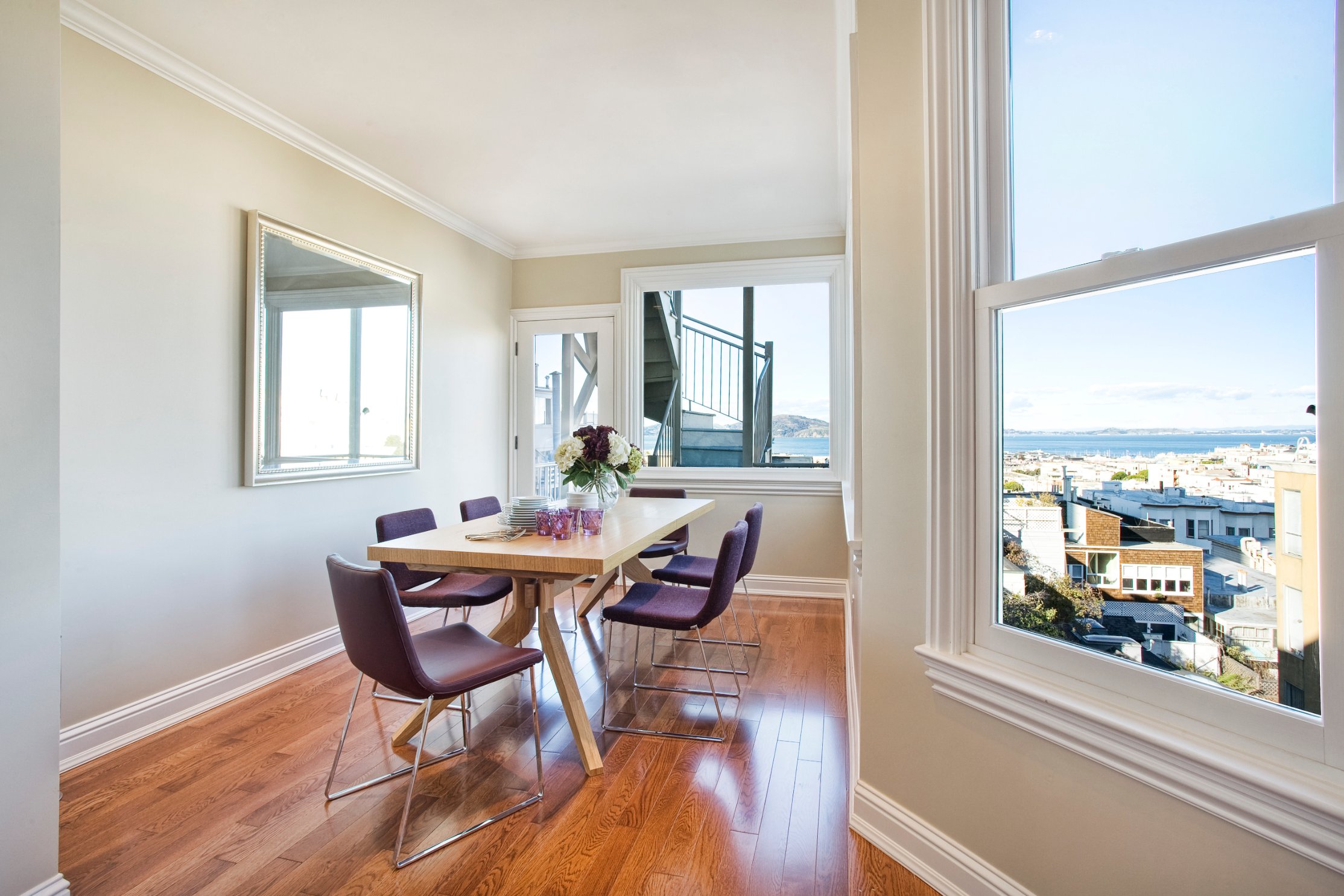 Green Street B Residence study with a wood desk and city view
