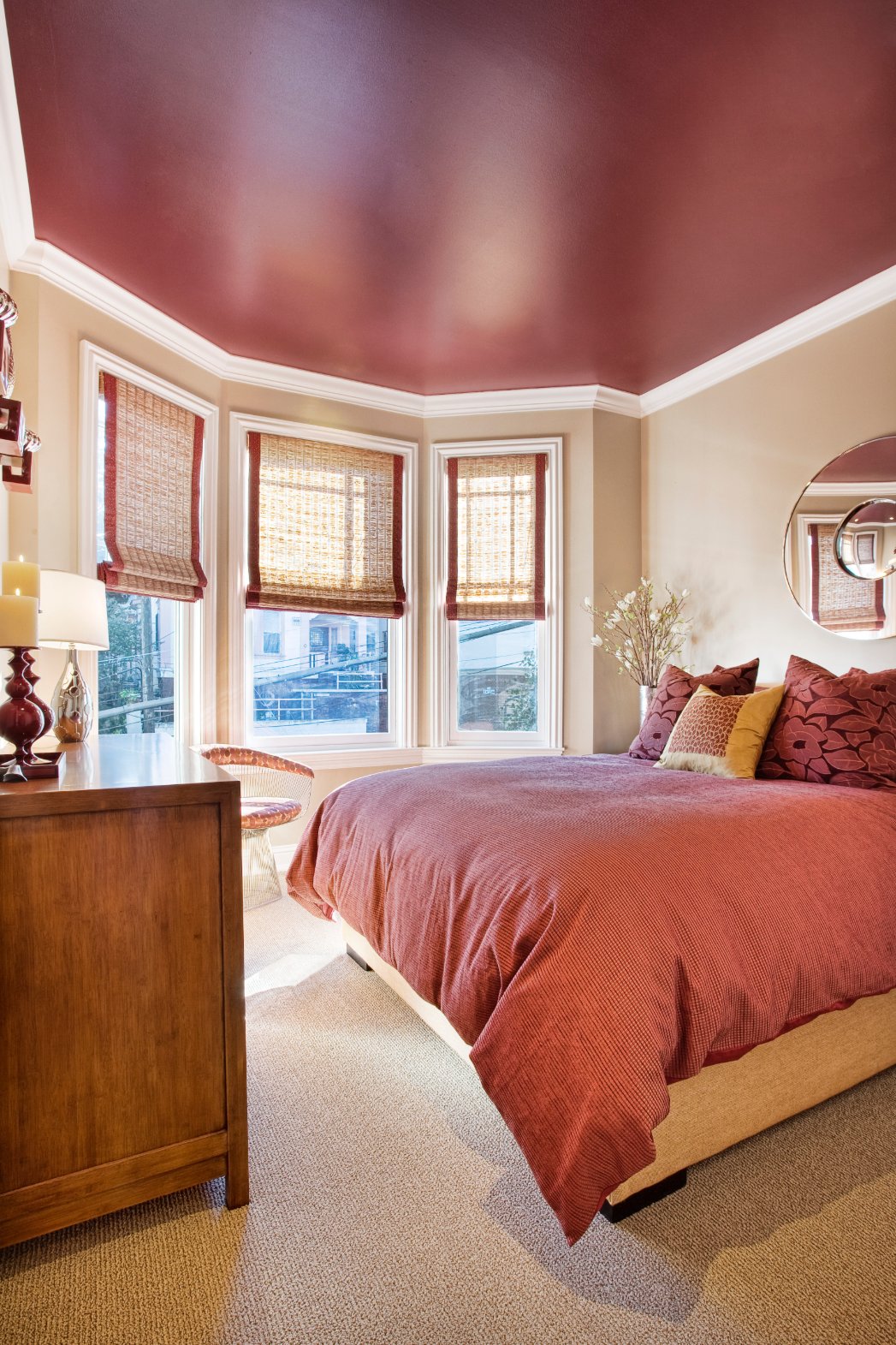 Green Street B Residence sitting area with red cabinetry and upholstered chairs