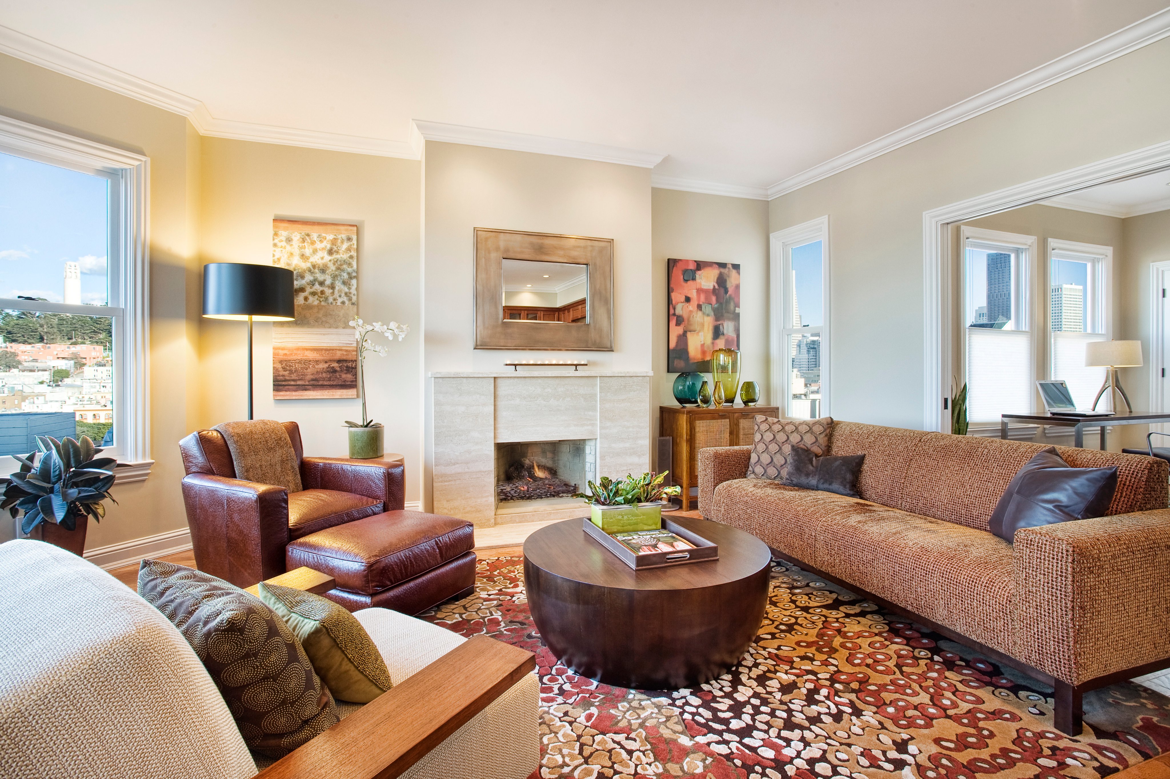 Green Street A Residence living room with fireplace and layered seating