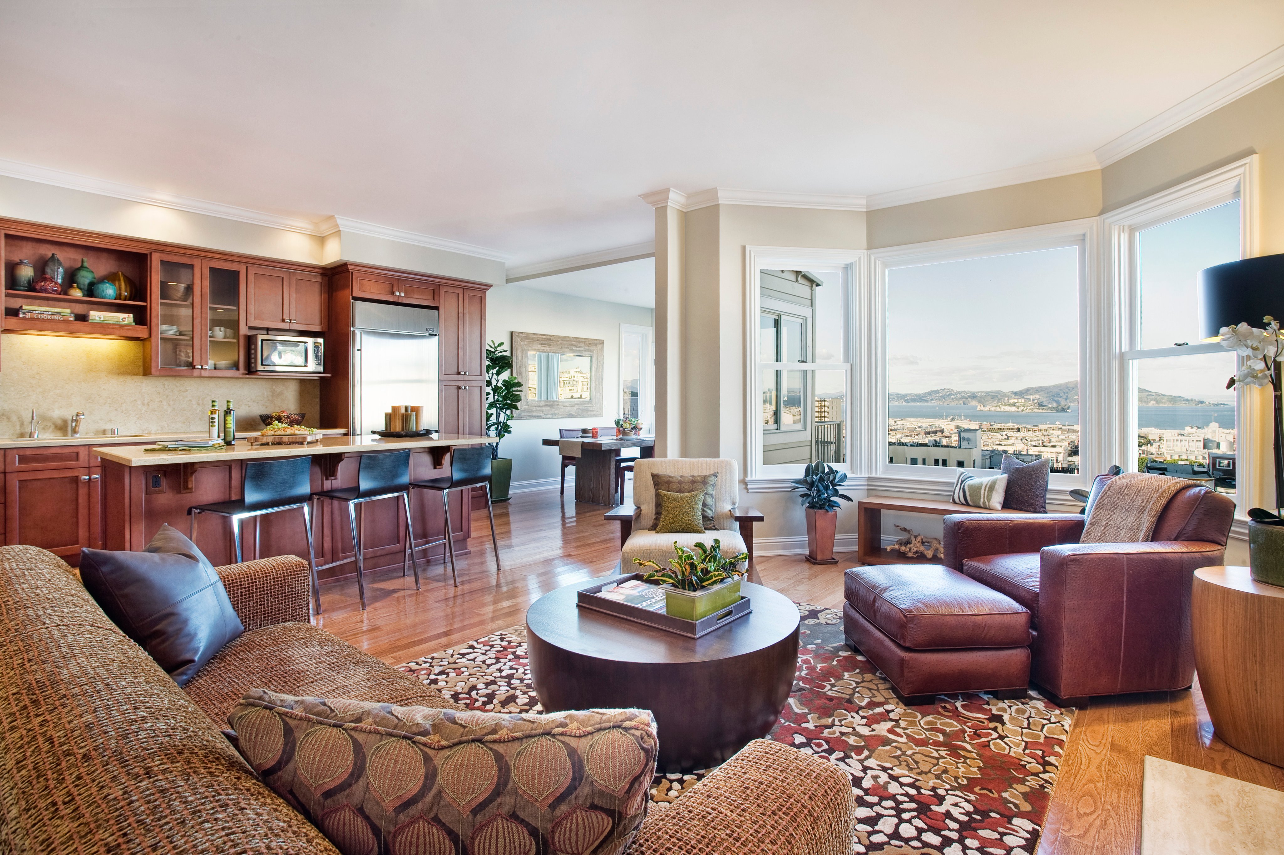 Green Street A Residence open kitchen and living area with bay windows