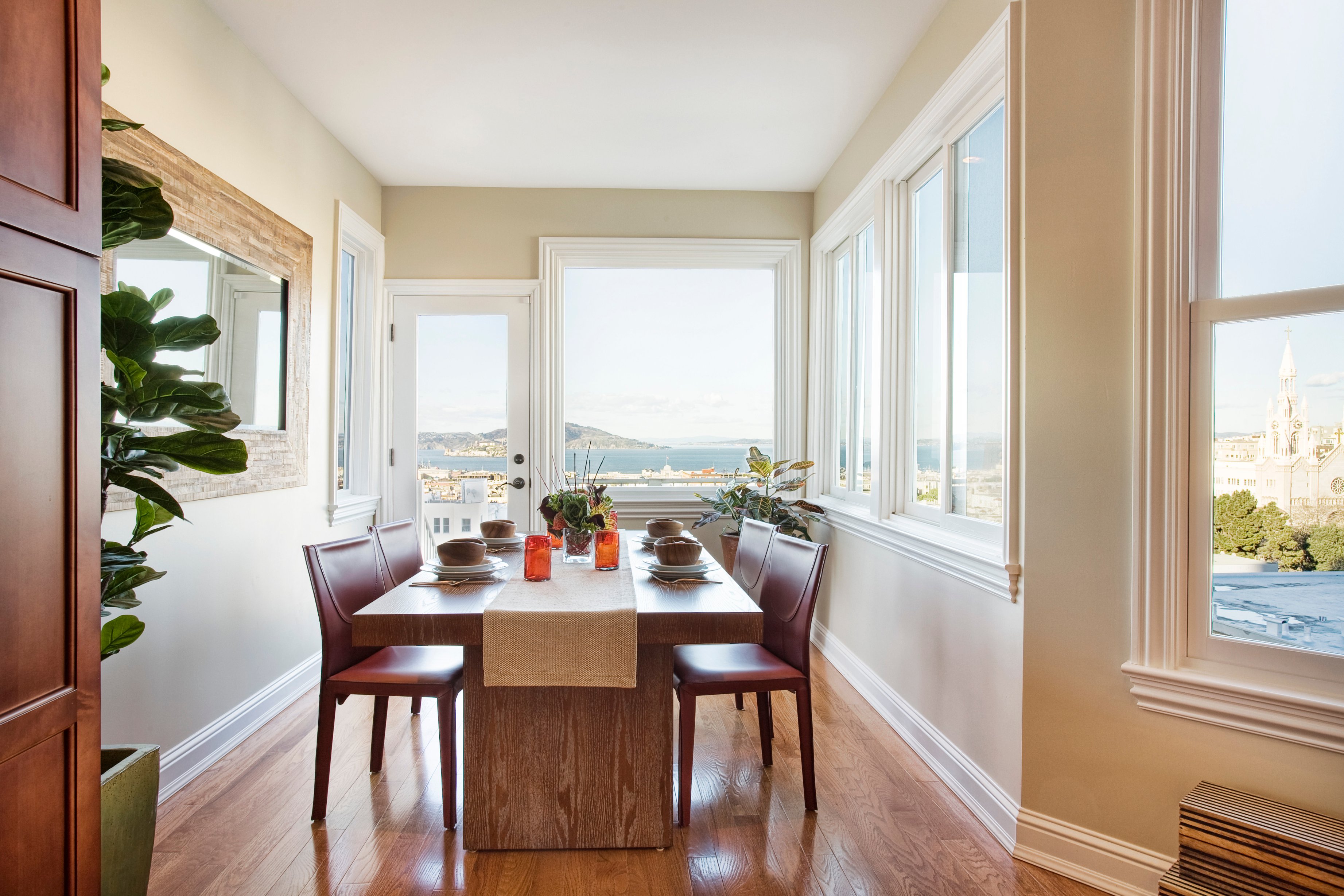Green Street A Residence dining room with bay views