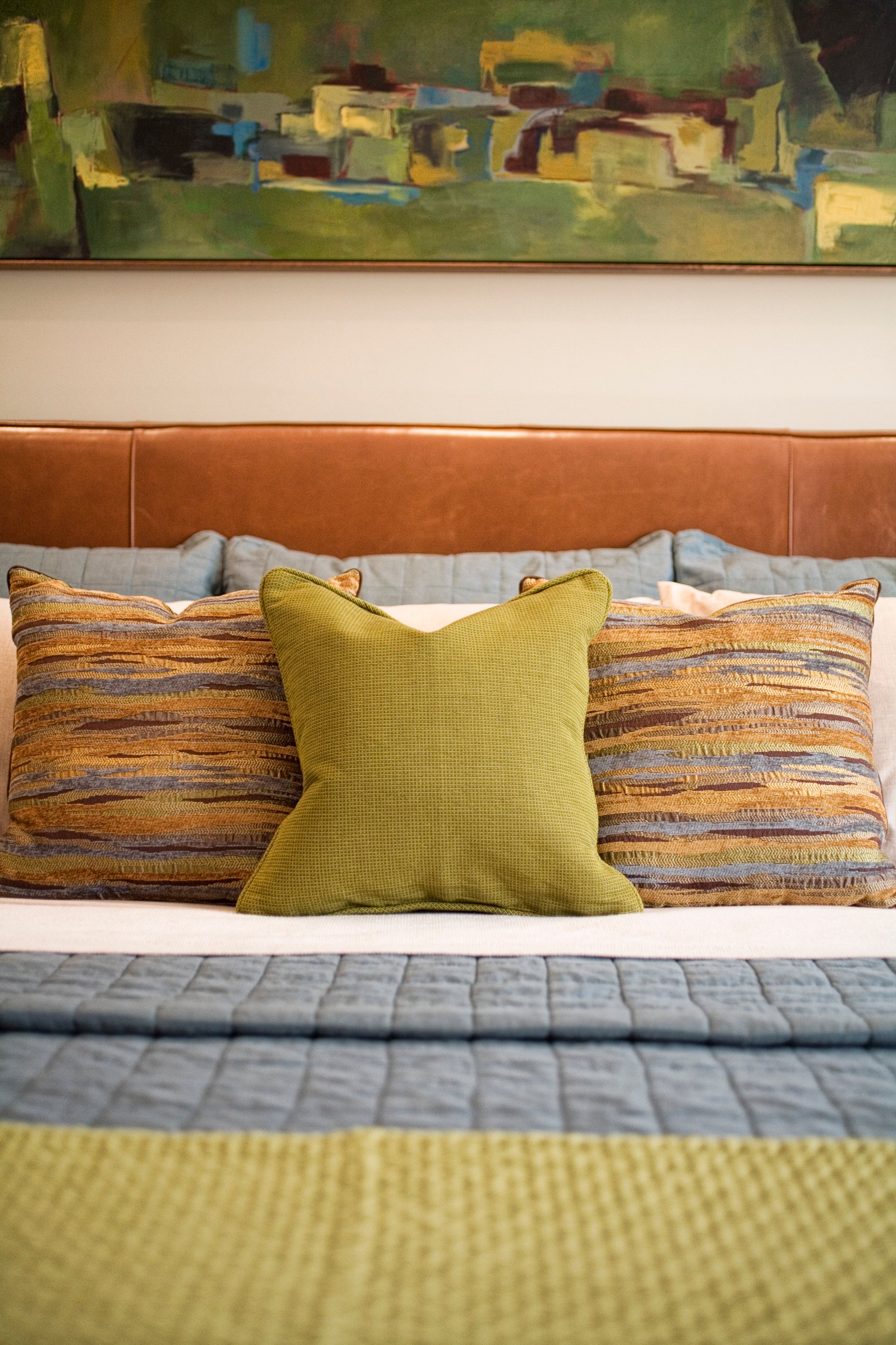 Green Street A Residence bedroom pillow and headboard detail