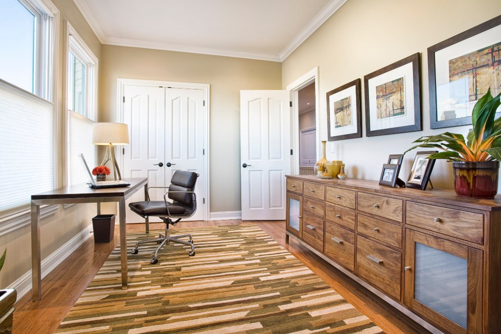 Green Street A Residence home office with desk and gallery wall