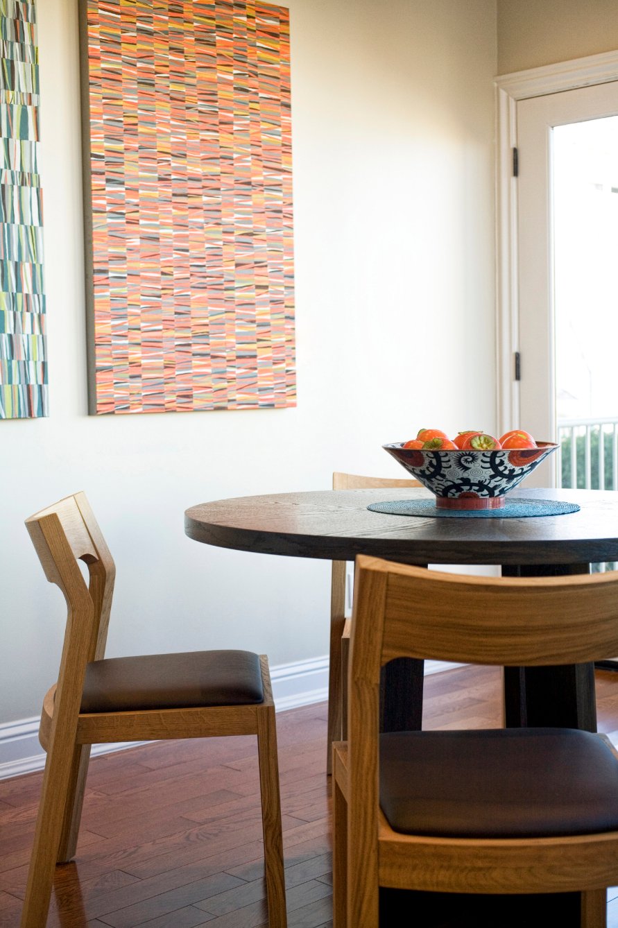 Green Street C Residence round dining table beside a window