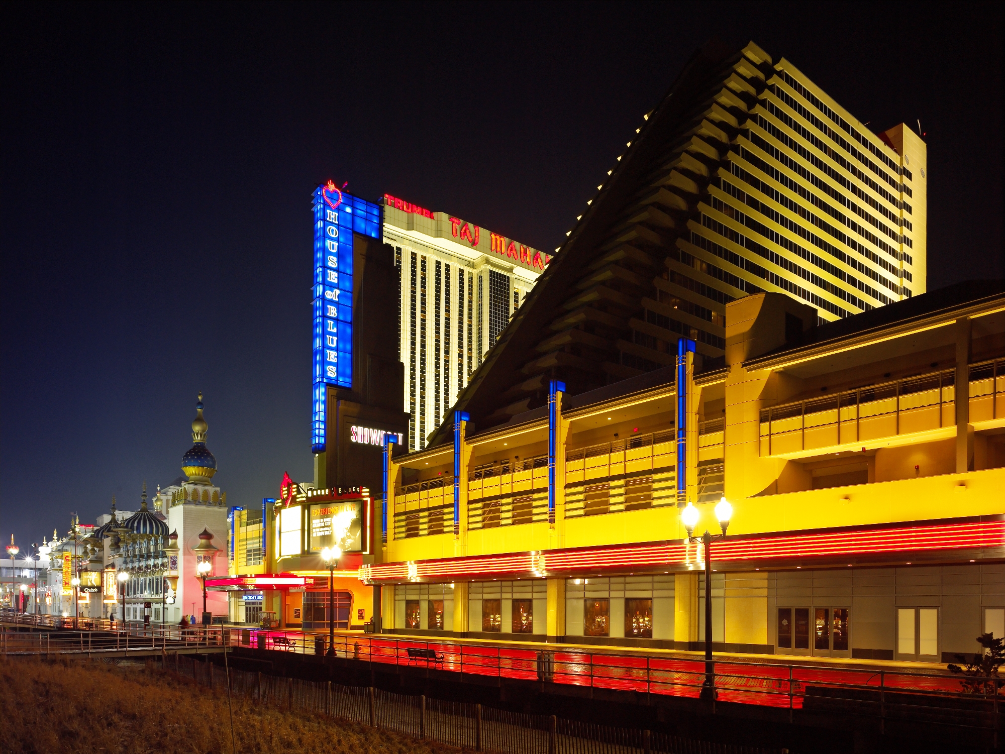 House of Blues and casino complex illuminated along the Atlantic City boardwalk at night