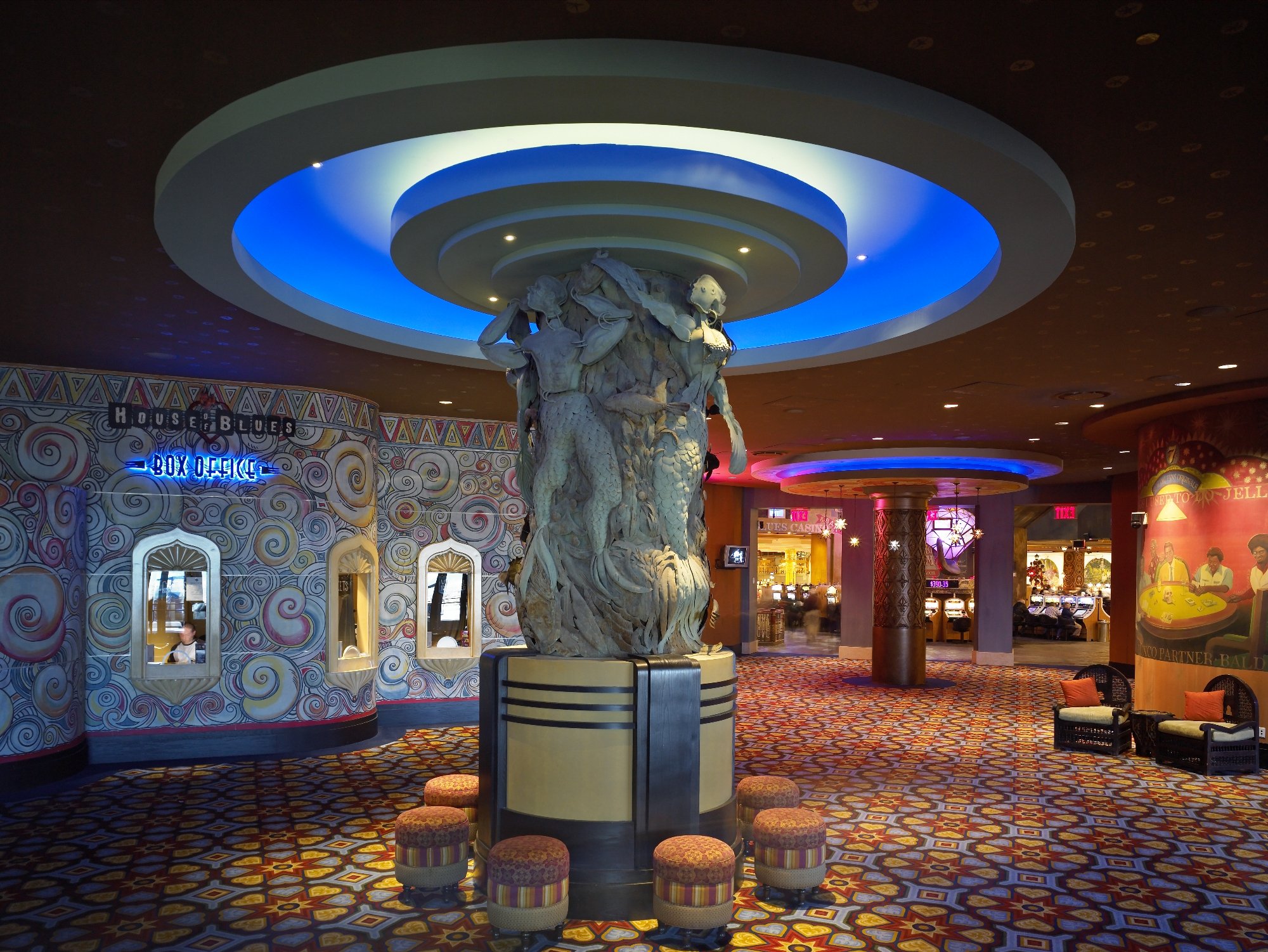 House of Blues casino lobby with a monumental sculptural column and vivid patterned interior