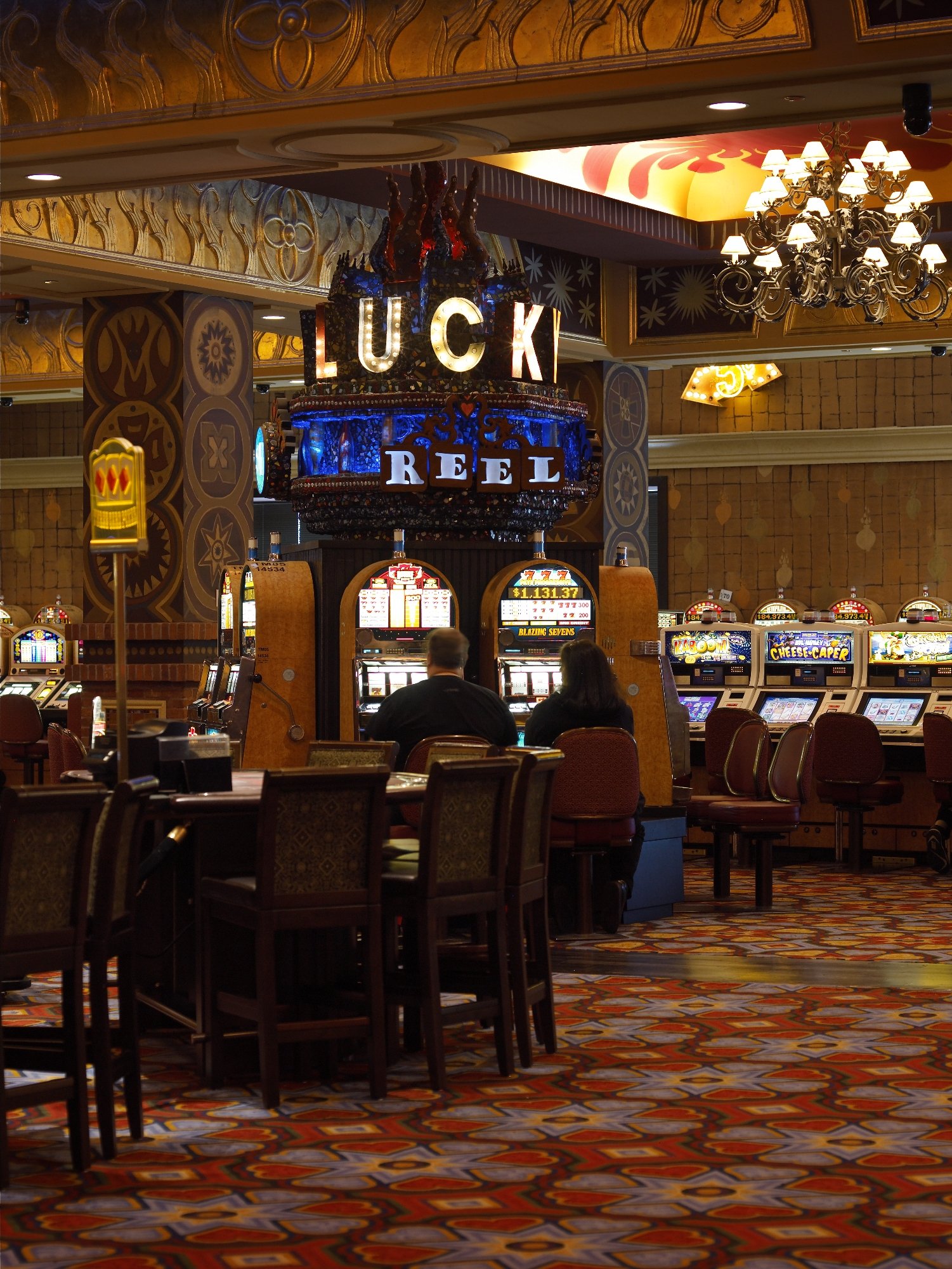 Lucky Reel casino installation with sculptural signage and slot machines
