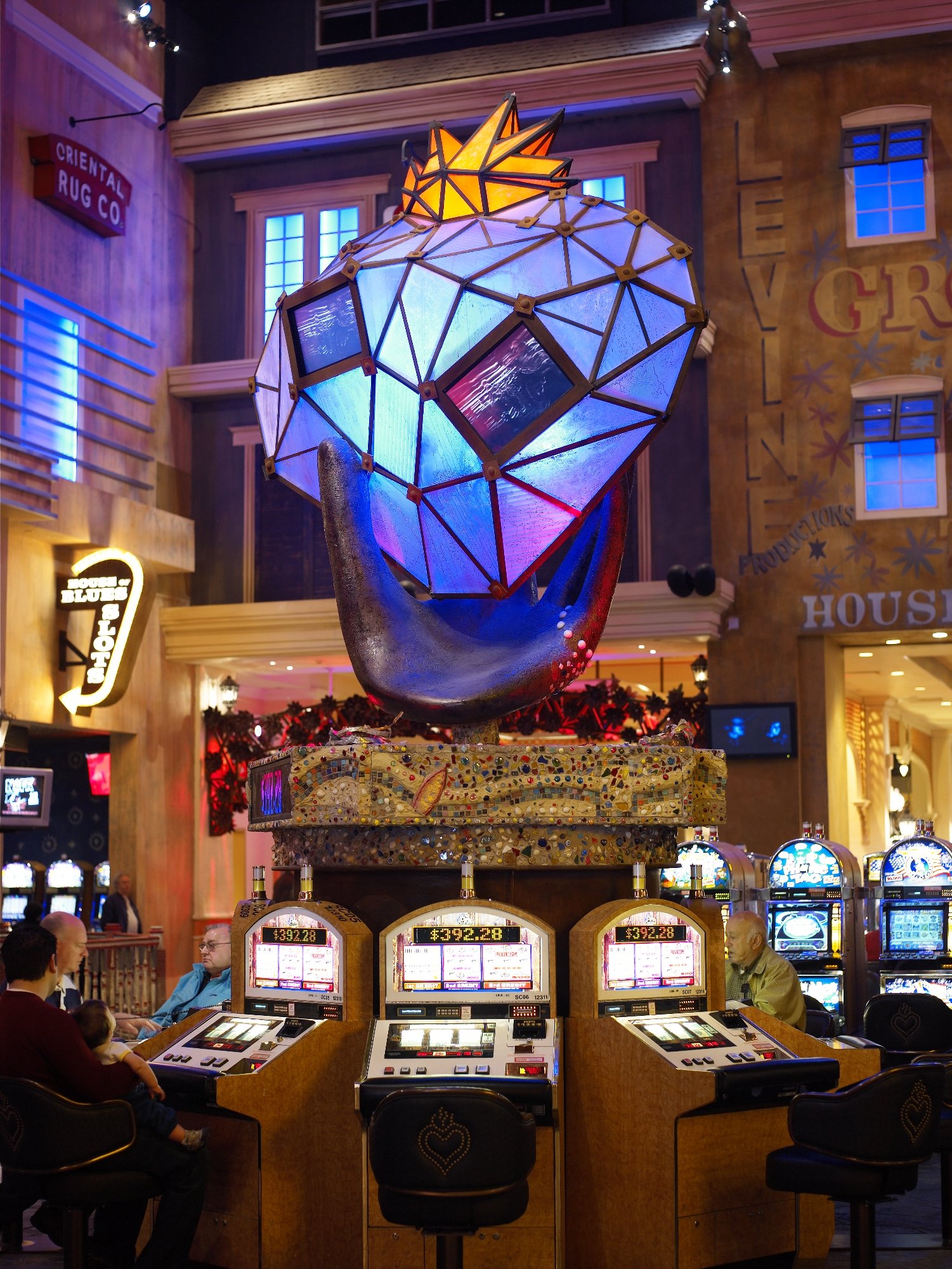 Faceted illuminated heart sculpture above the casino floor