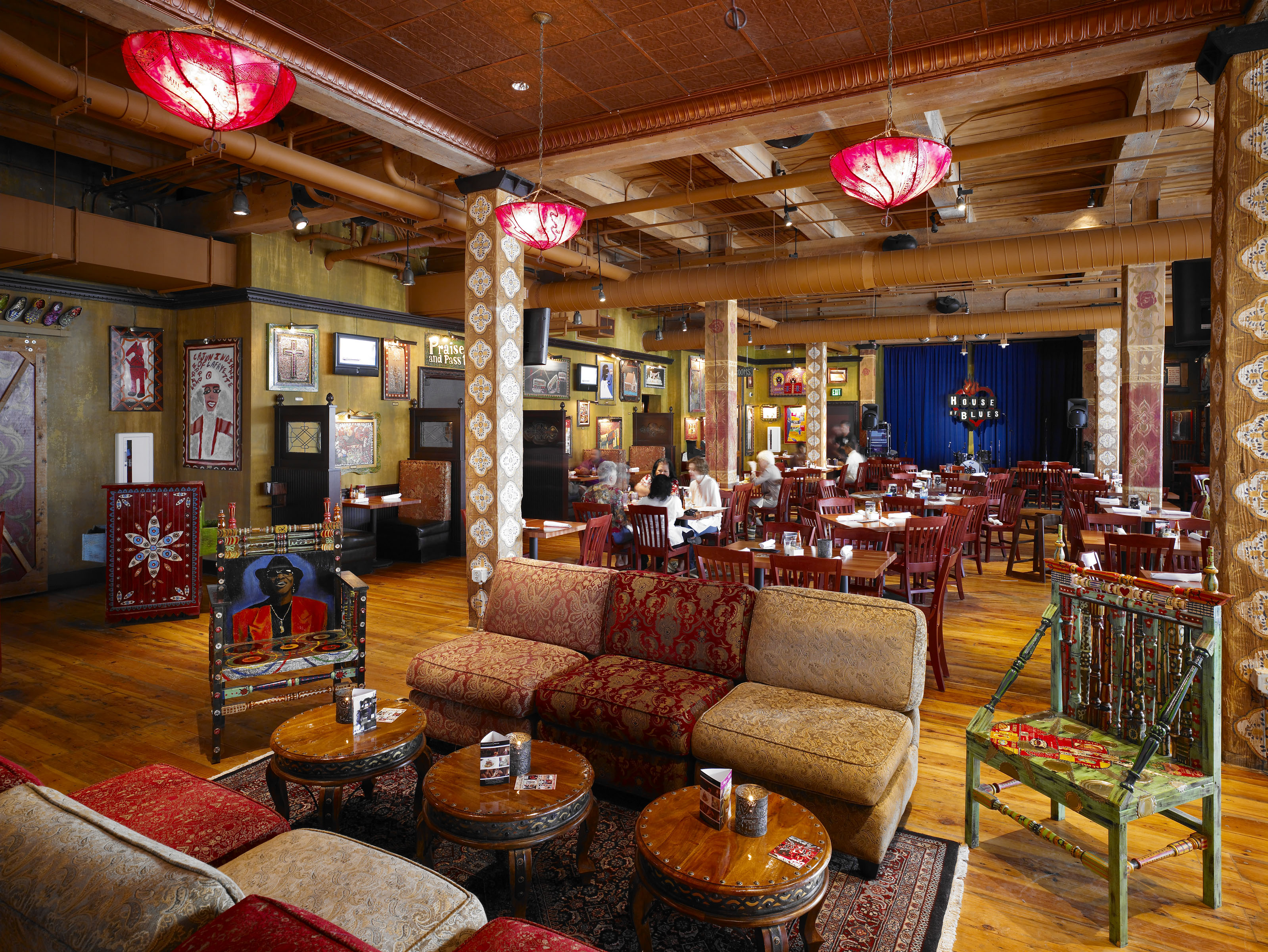House of Blues Dallas restaurant lounge with richly layered furnishings and folk art