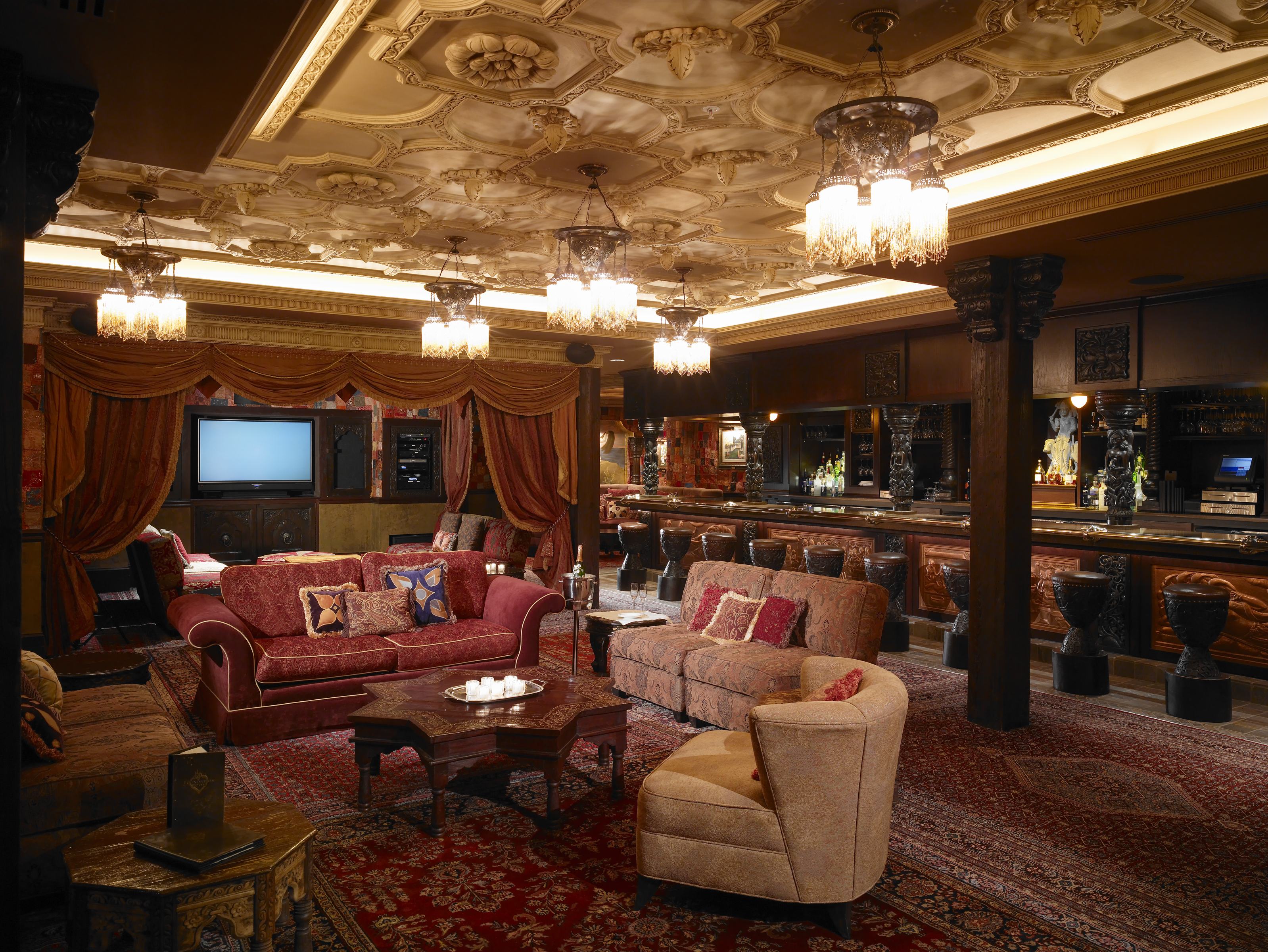 Foundation Room lounge with ornate plaster ceiling and intimate seating groups