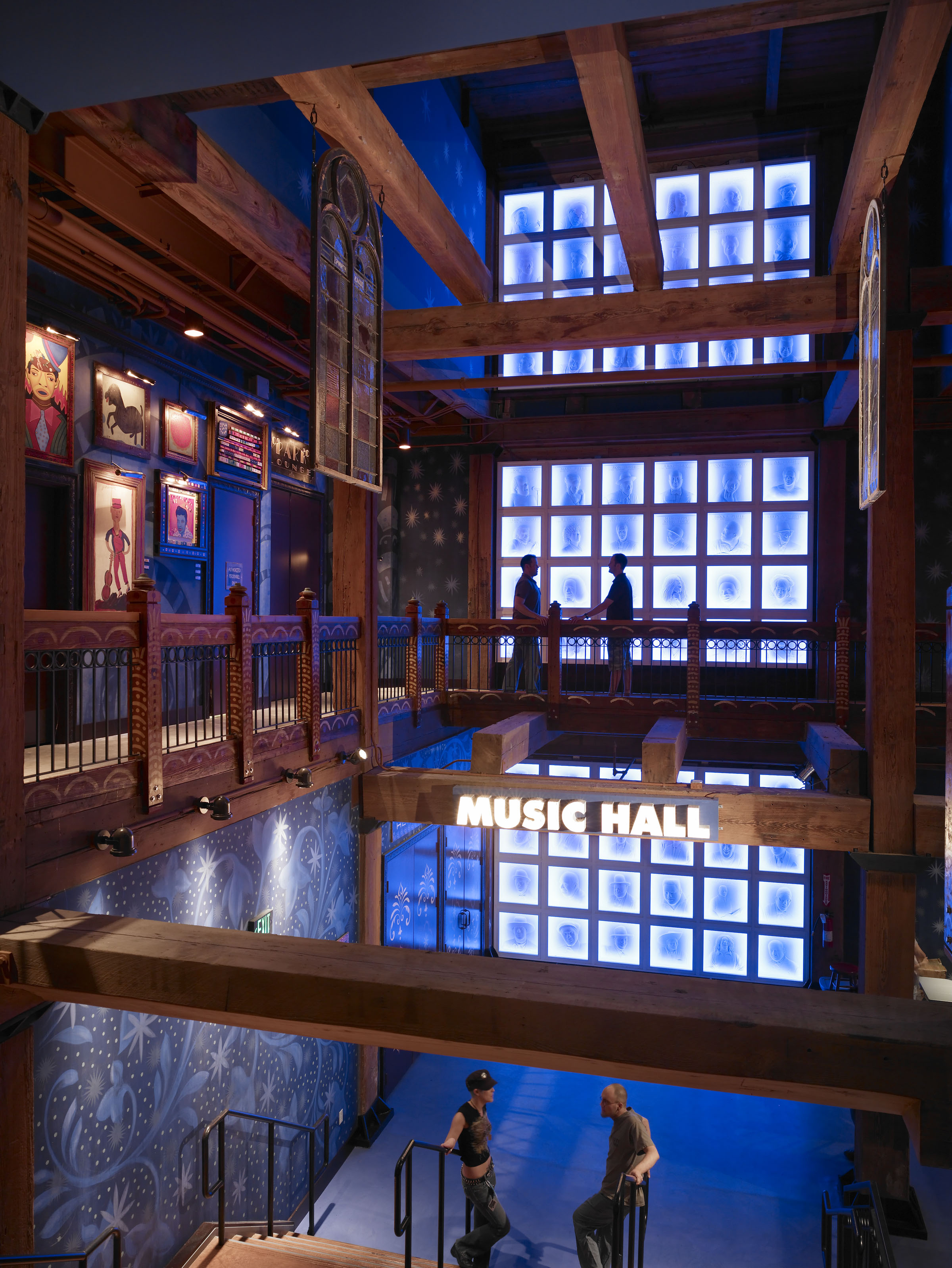 Multi-level Music Hall lobby with exposed timber structure and blue window light