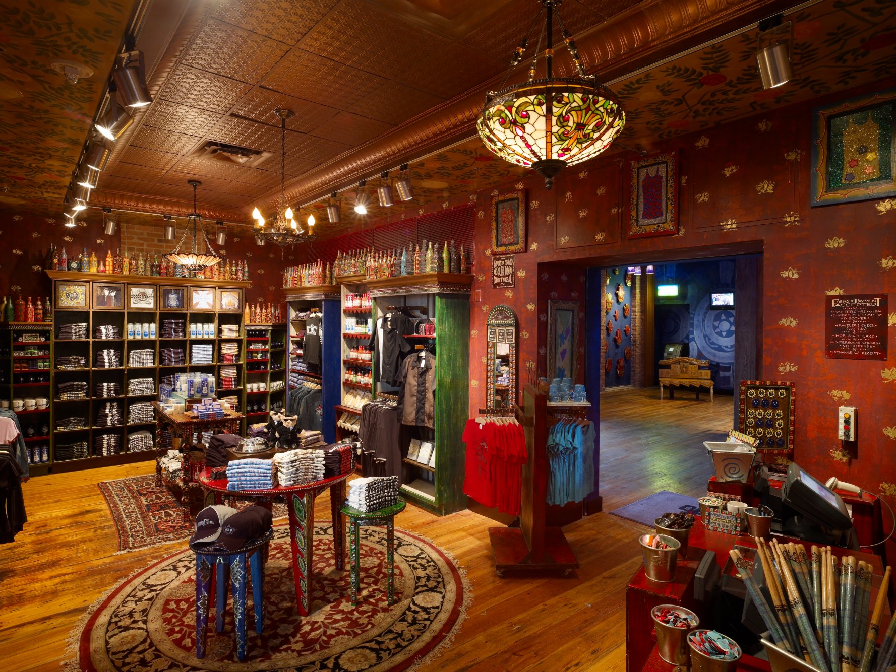 House of Blues retail interior with timber ceiling, display cases, and folk art