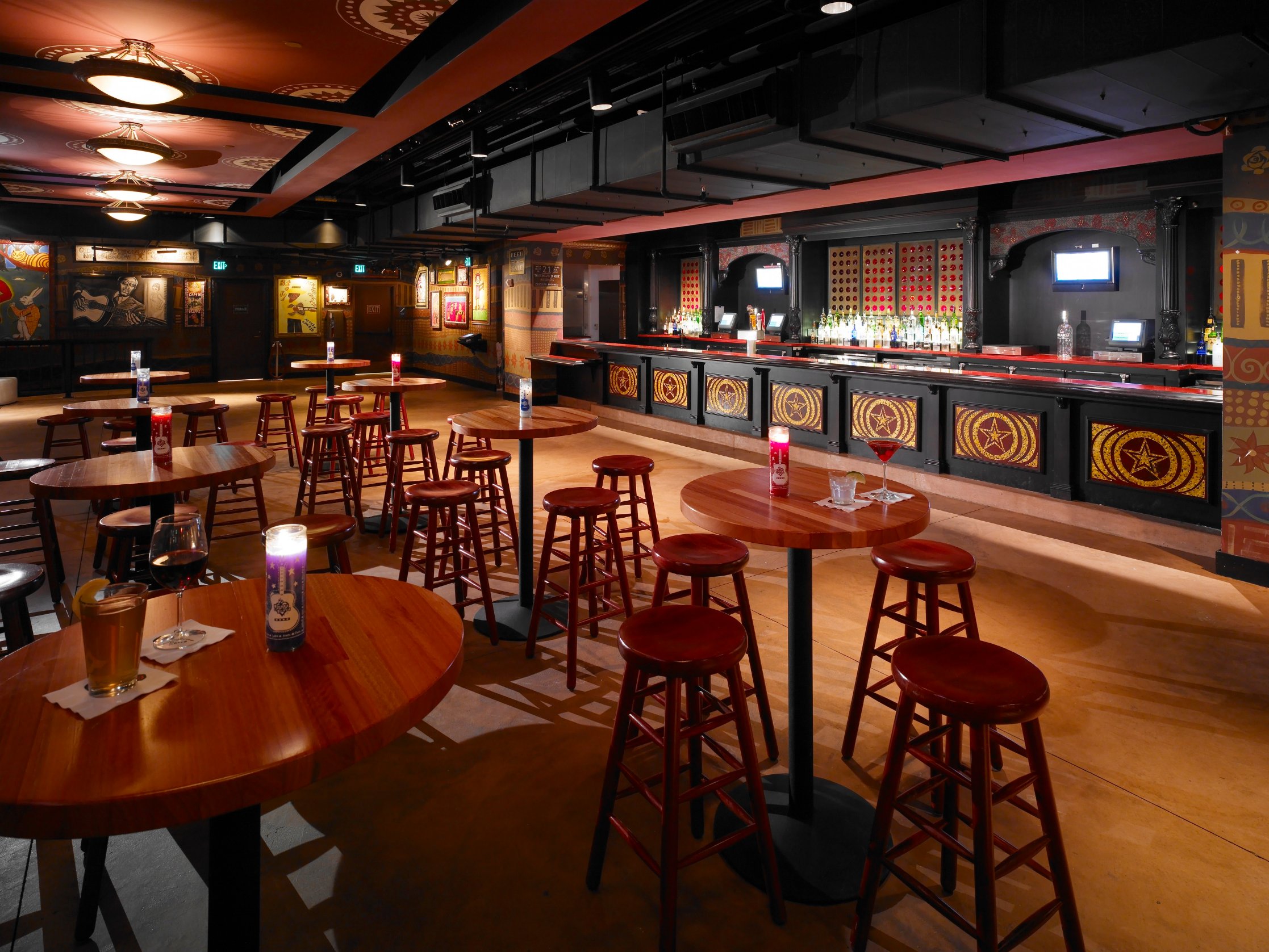 Restaurant bar and dining area with warm woodwork and red accents