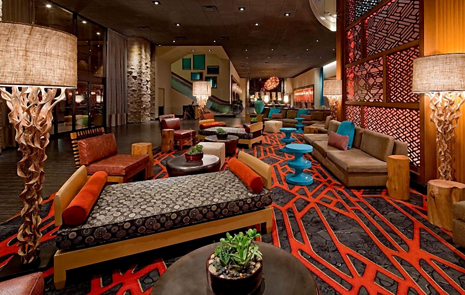 Hyatt Hotel lounge with layered seating and a bold patterned carpet
