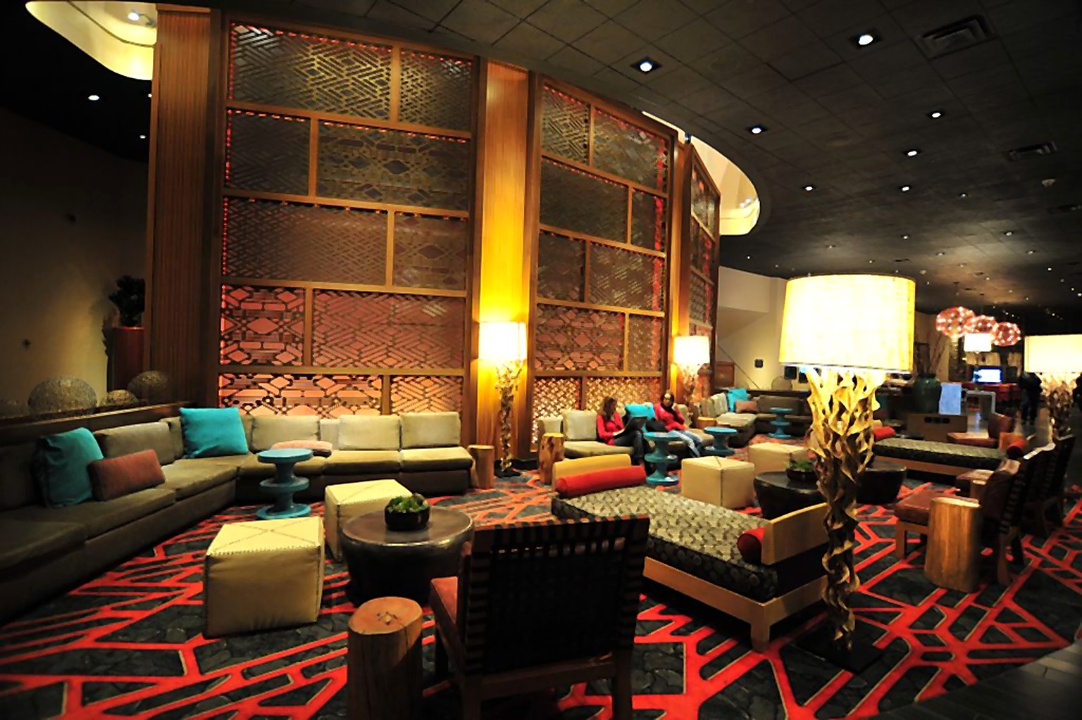 Hyatt Hotel lobby lounge with turquoise seating and tall patterned screens