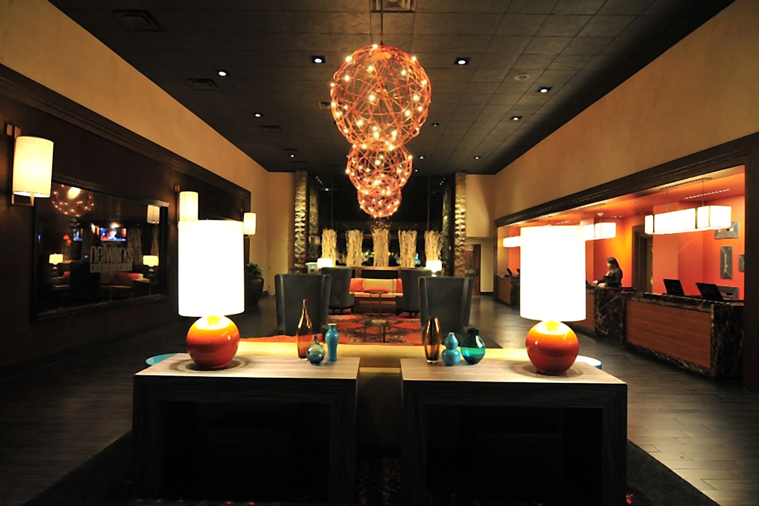 Hyatt Hotel lobby console beneath clustered amber pendant lights
