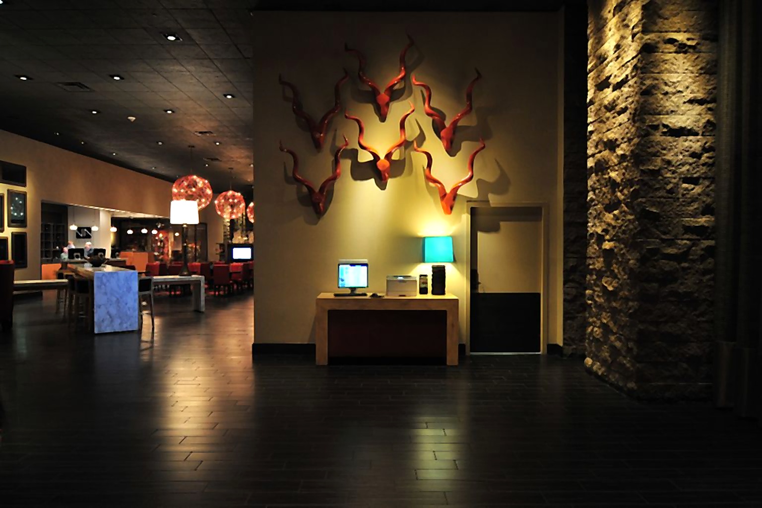 Hyatt Hotel lobby art wall beside a textured stone column