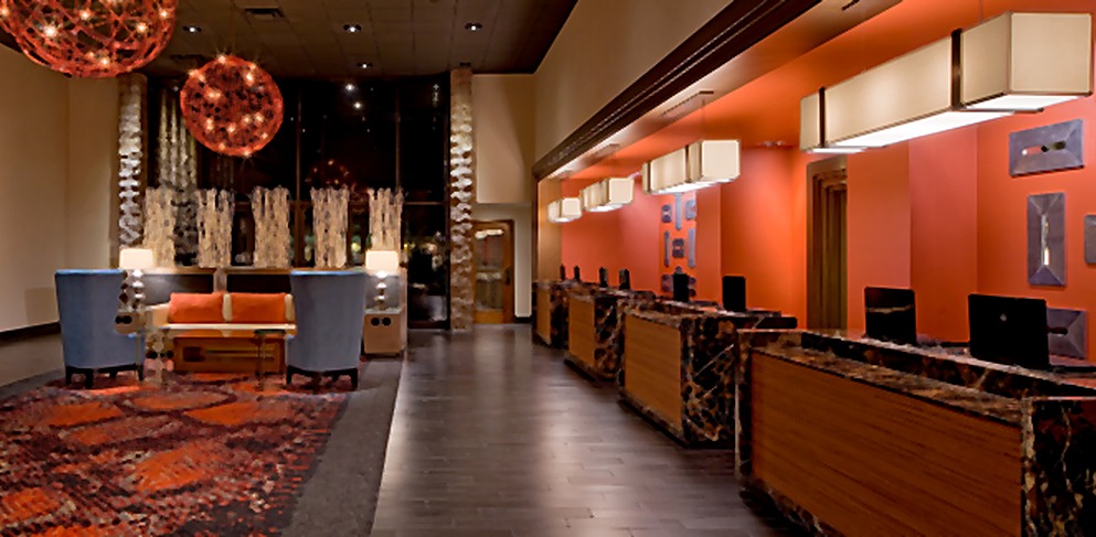 Hyatt Hotel front desk beneath clustered amber pendant lights