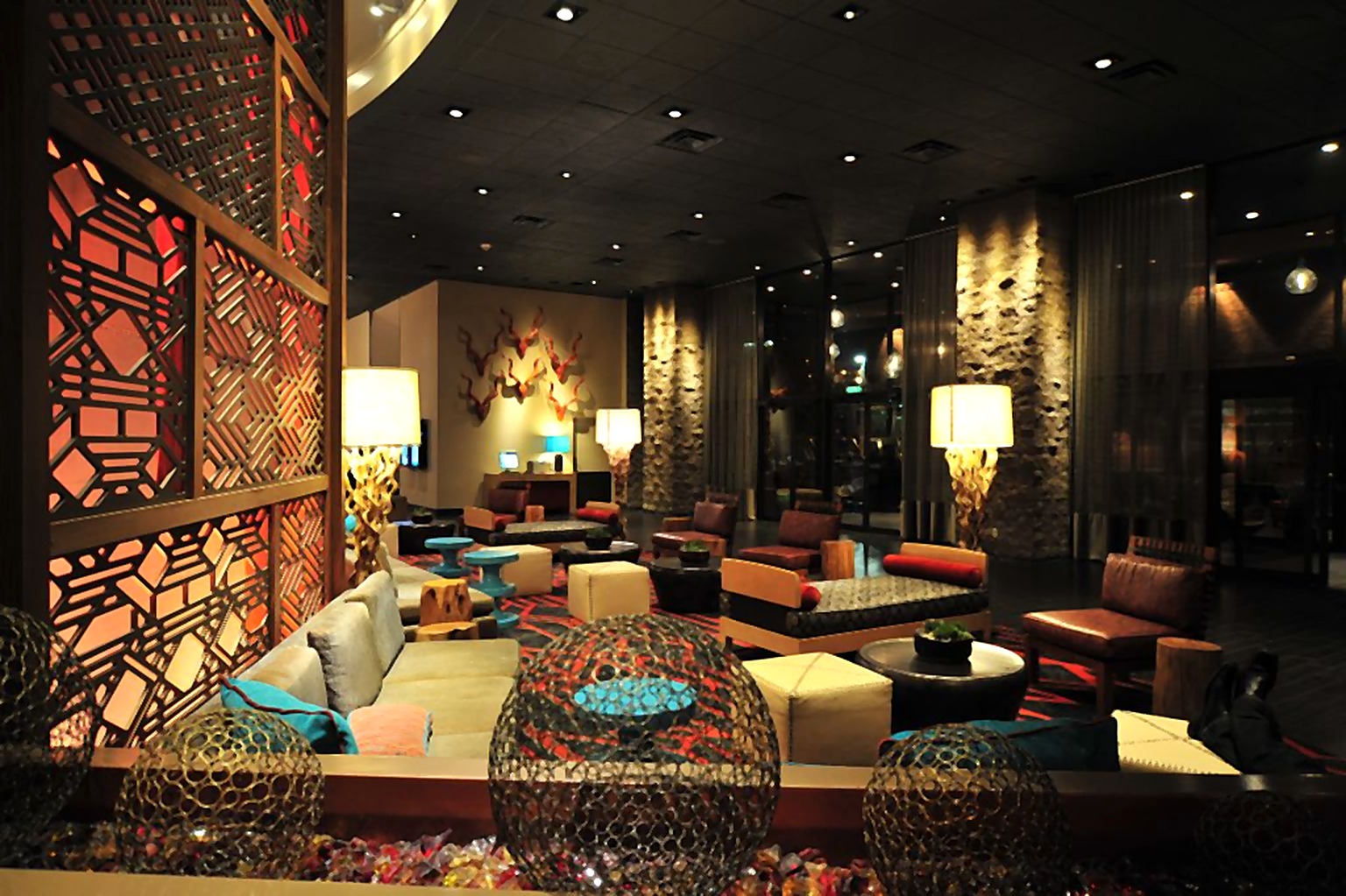 Hyatt Hotel lobby with colorful lounge seating and patterned architectural screens