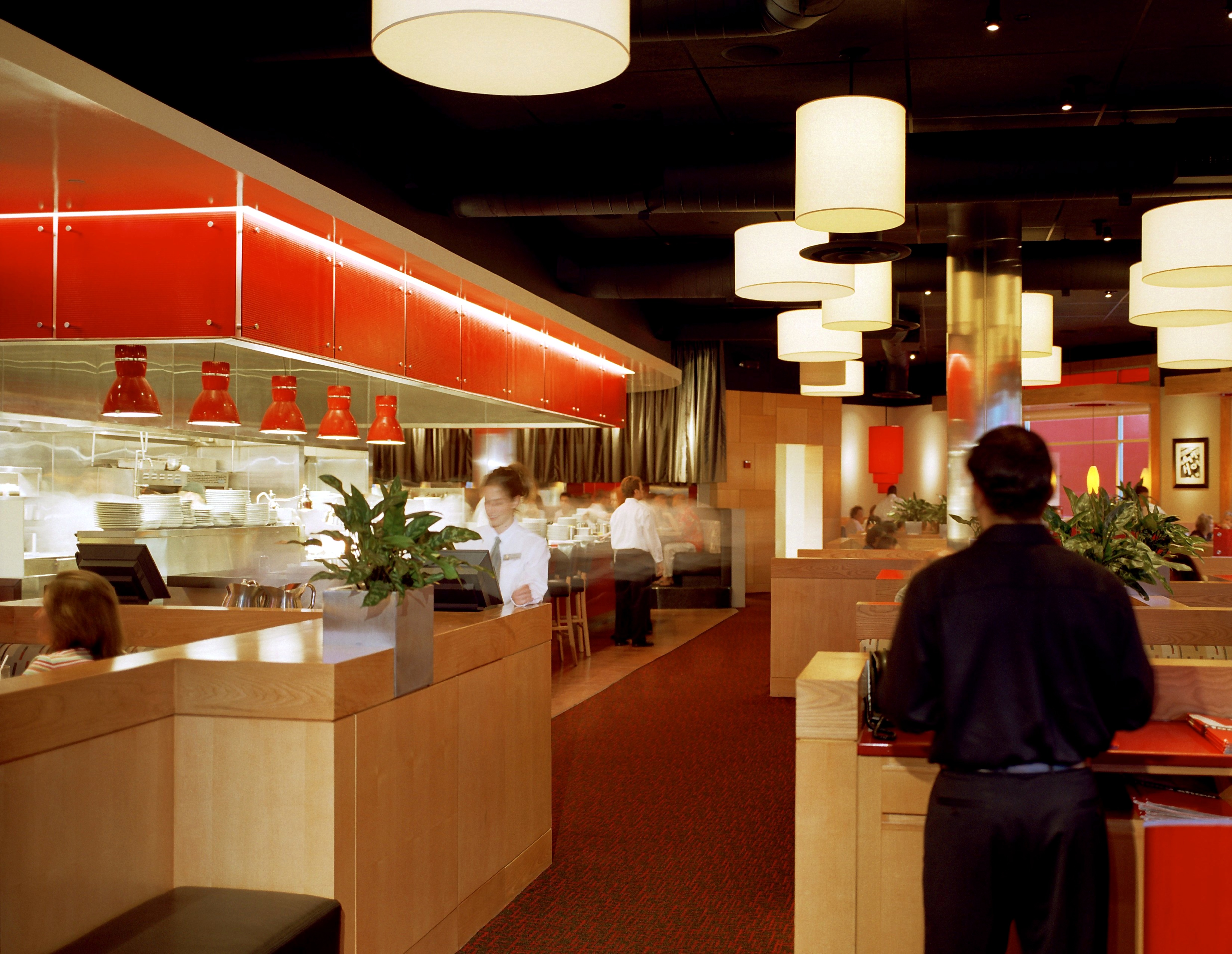LA Food Show dining room and open kitchen with staff preparing for service