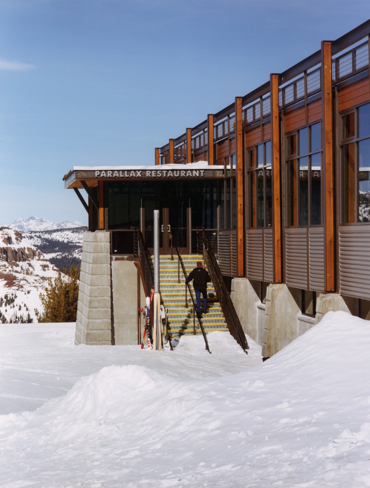 Parallax restaurant entrance rising above the snow