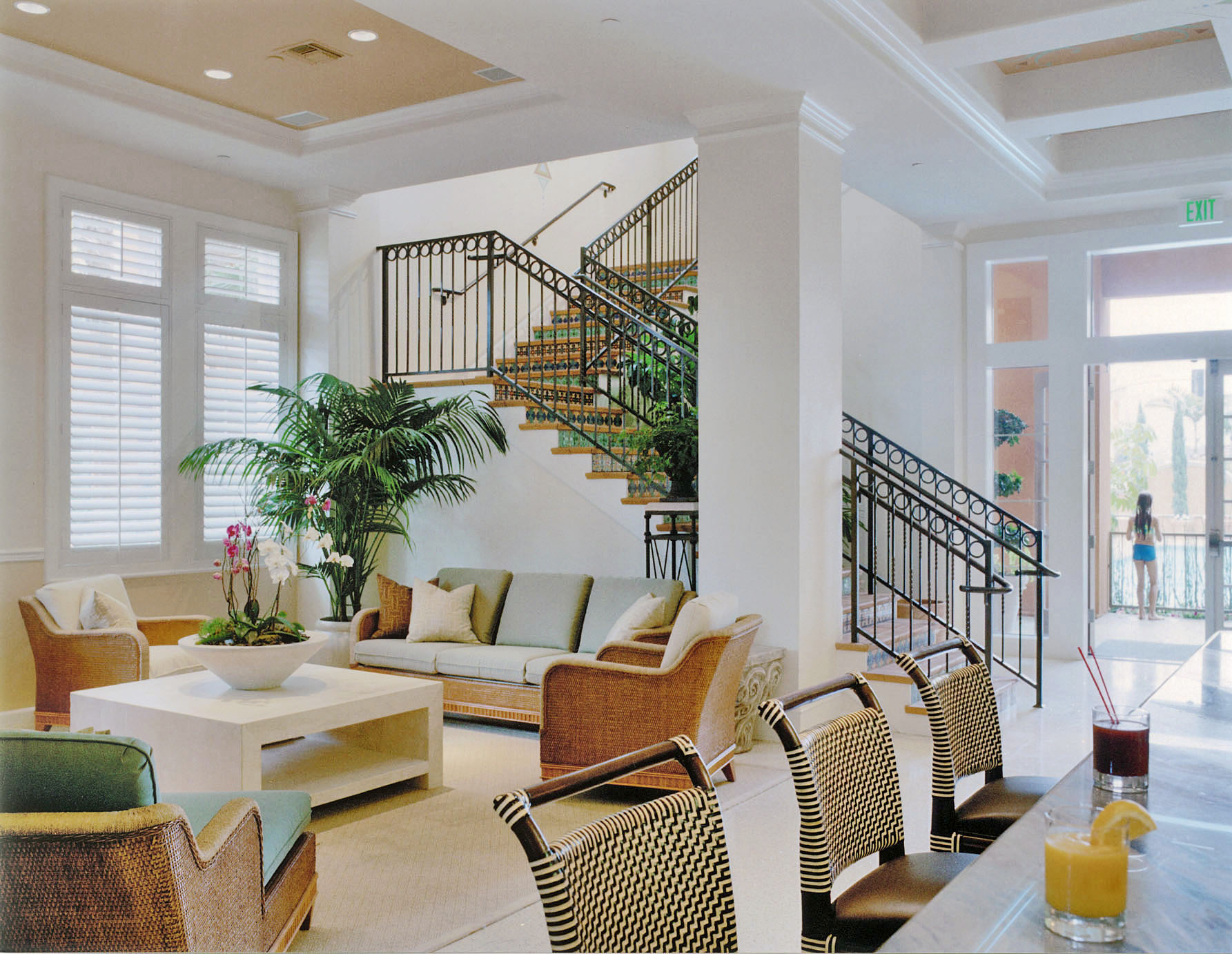 Spa at the Palazzo lounge with wicker seating and a sculptural staircase