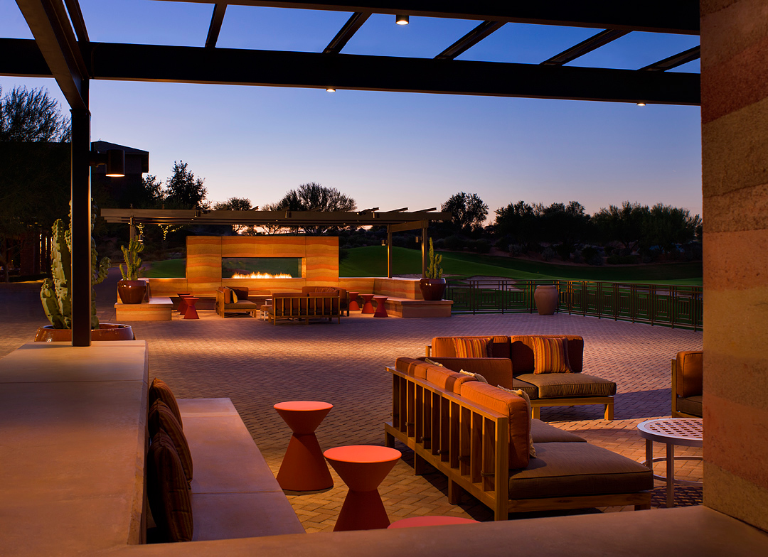 Spacious Westin Kierland terrace arranged around a glowing linear fireplace