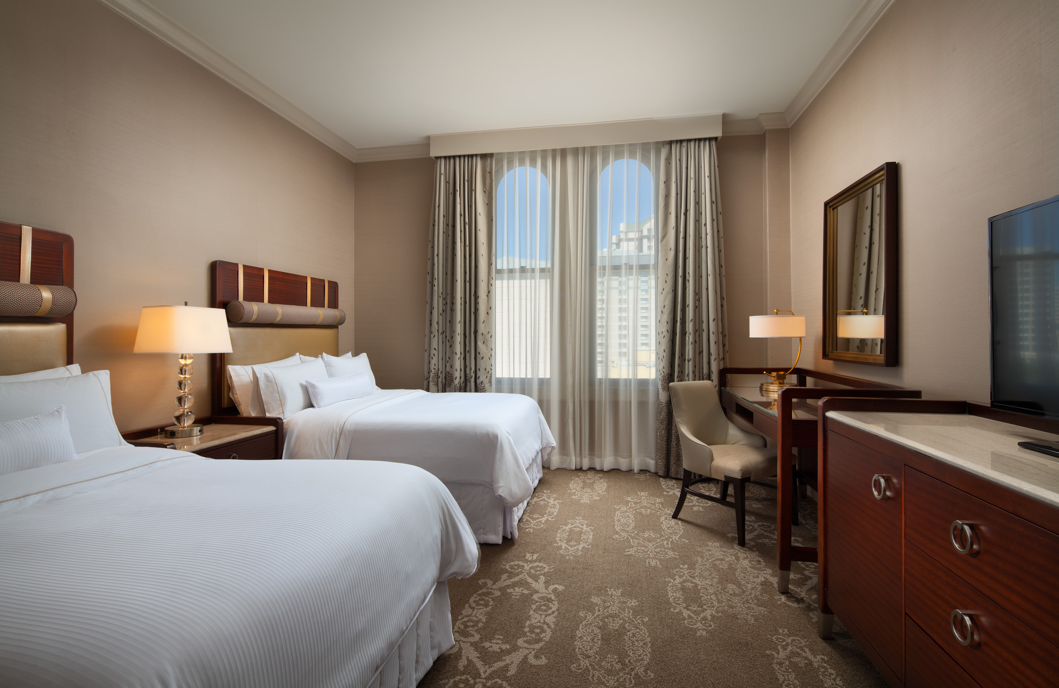 The Westin St Claire king guest room with neutral upholstery and a window seating area
