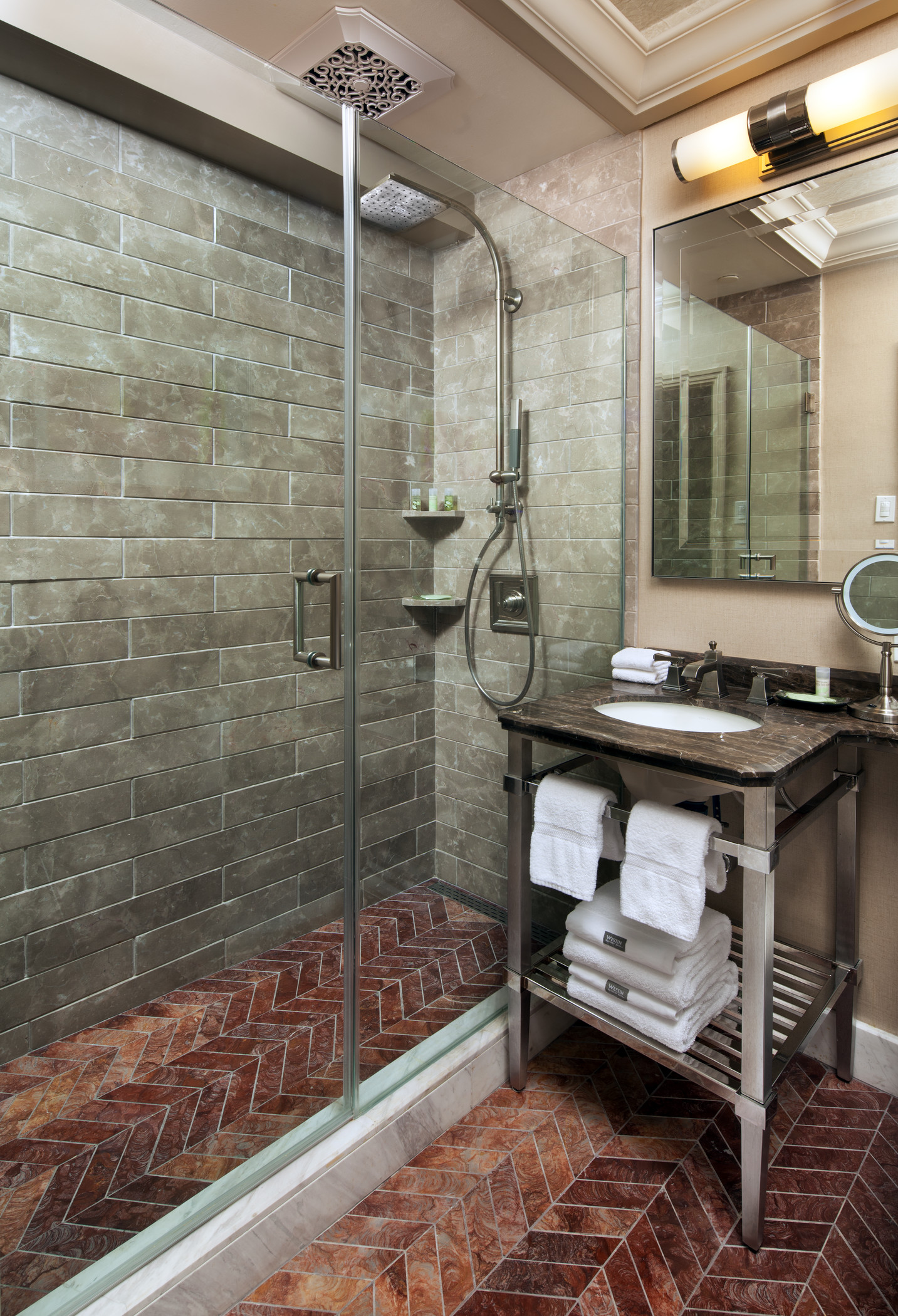 The Westin St Claire guest bathroom with a glass shower and dark wood vanity