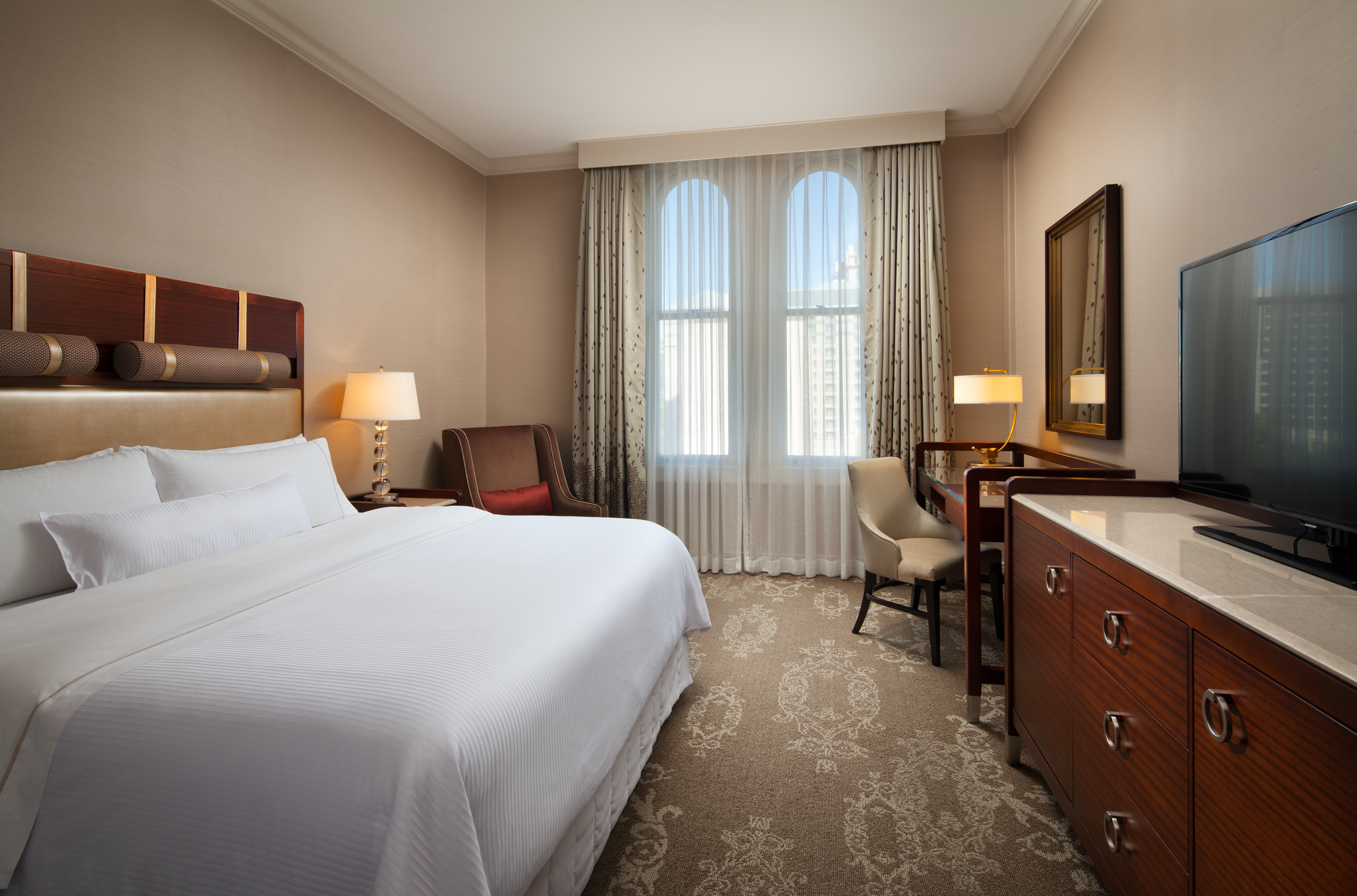 The Westin St Claire guest room with a king bed and window seating area