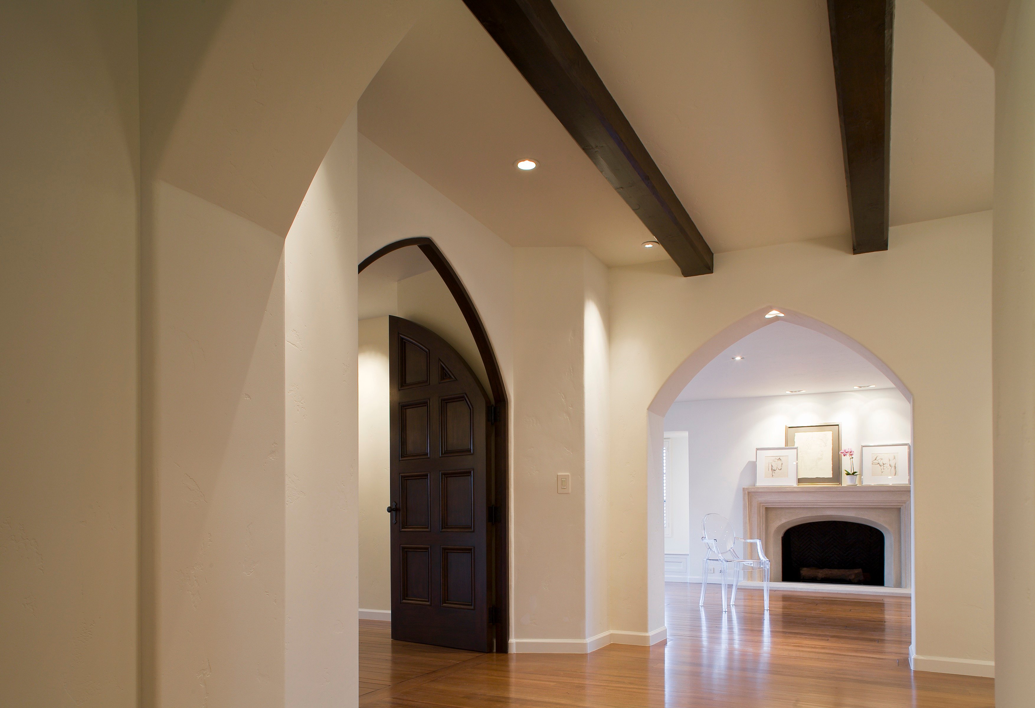 Garwood Residence interior with arched doorways and a fireplace