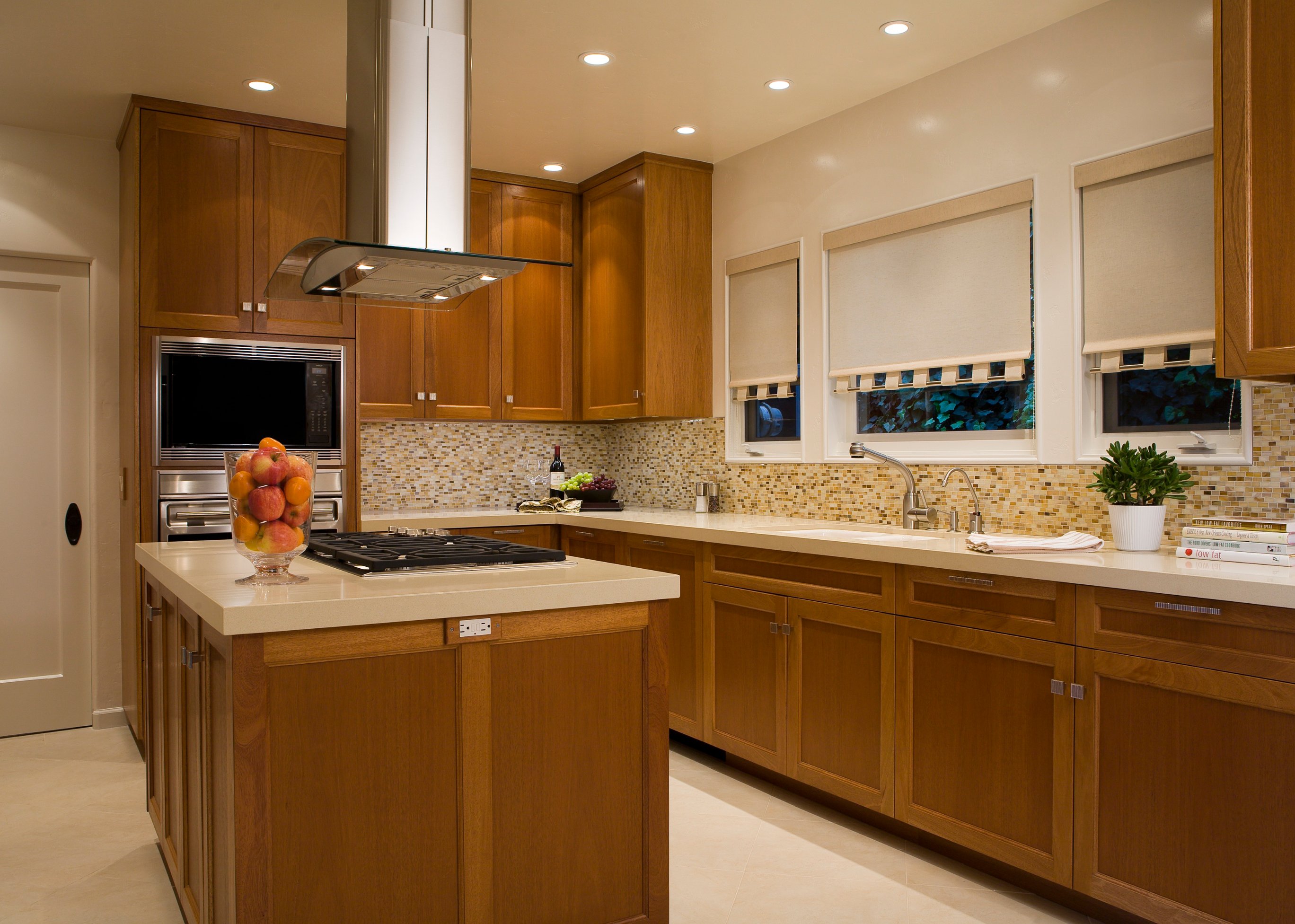 Garwood Residence kitchen with warm wood cabinetry and stone counters